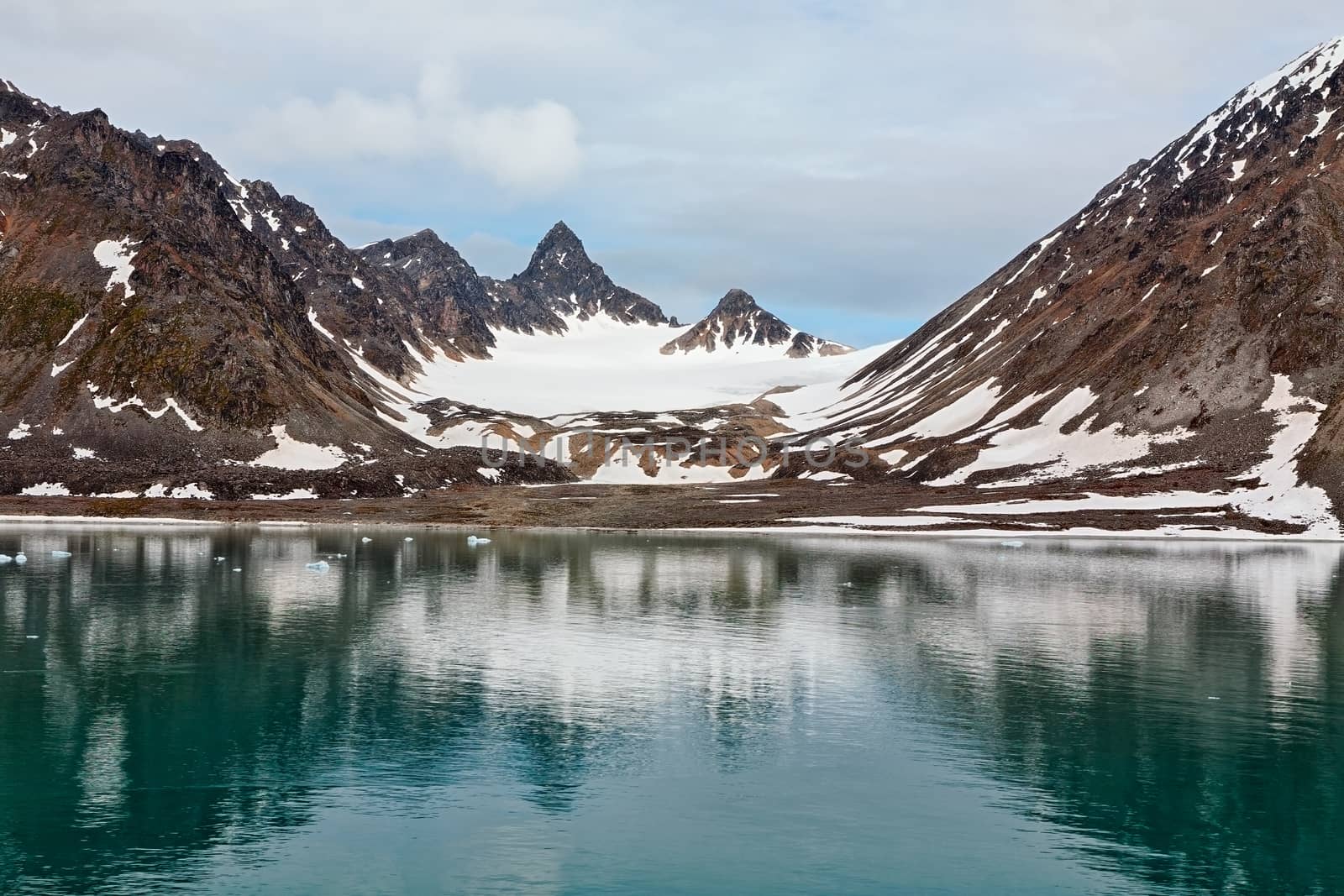 Snowy mountains along the Magdalenafjord in Svalbard islands, Norway