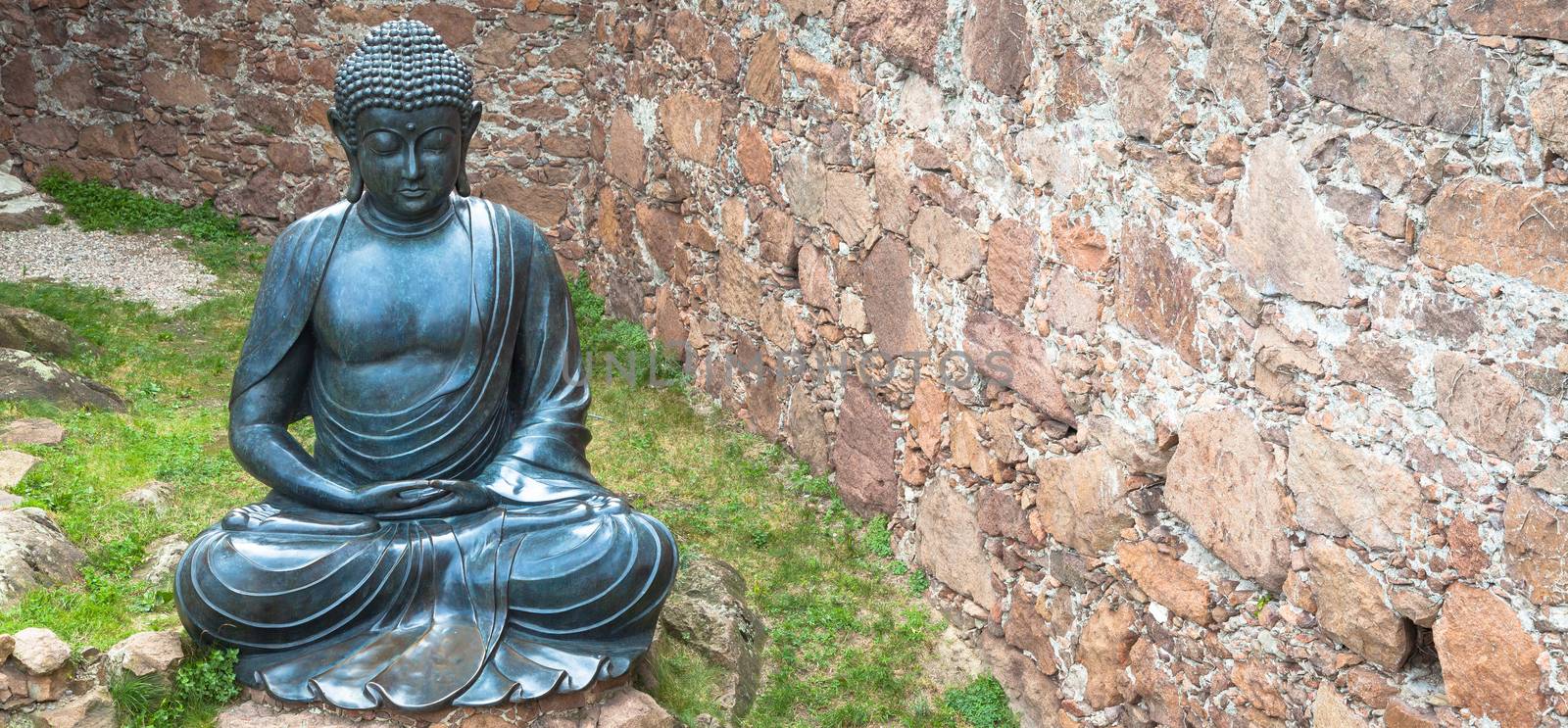 Meditating Buddha Statue, made of bronze. 19th Century, sitting stance, useful copyspace.