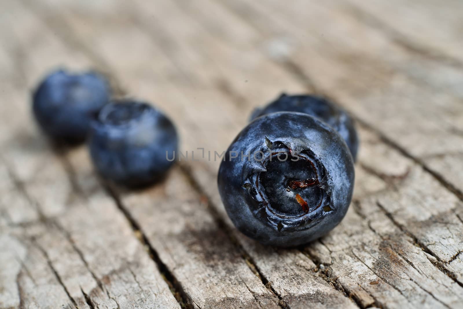 Organic blueberries on a rustic wooden table