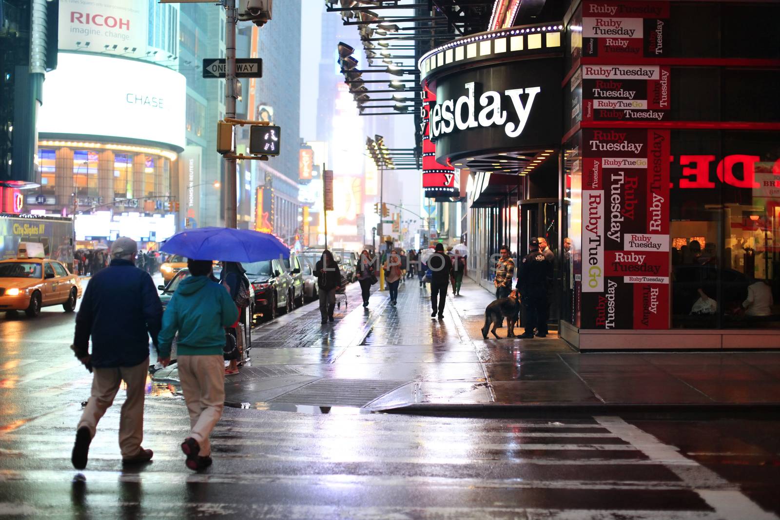 Time Square at night in the rain by friday