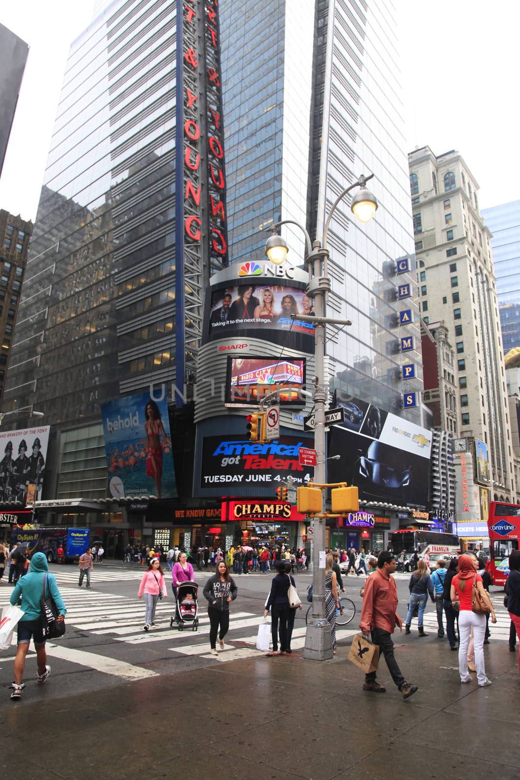 New York City, NY, USA - May 18, 2013: Times Square, featured with Broadway Theaters and huge number of LED signs, is a symbol of New York City and the United States, May 18, 2013 in Manhattan, New York City