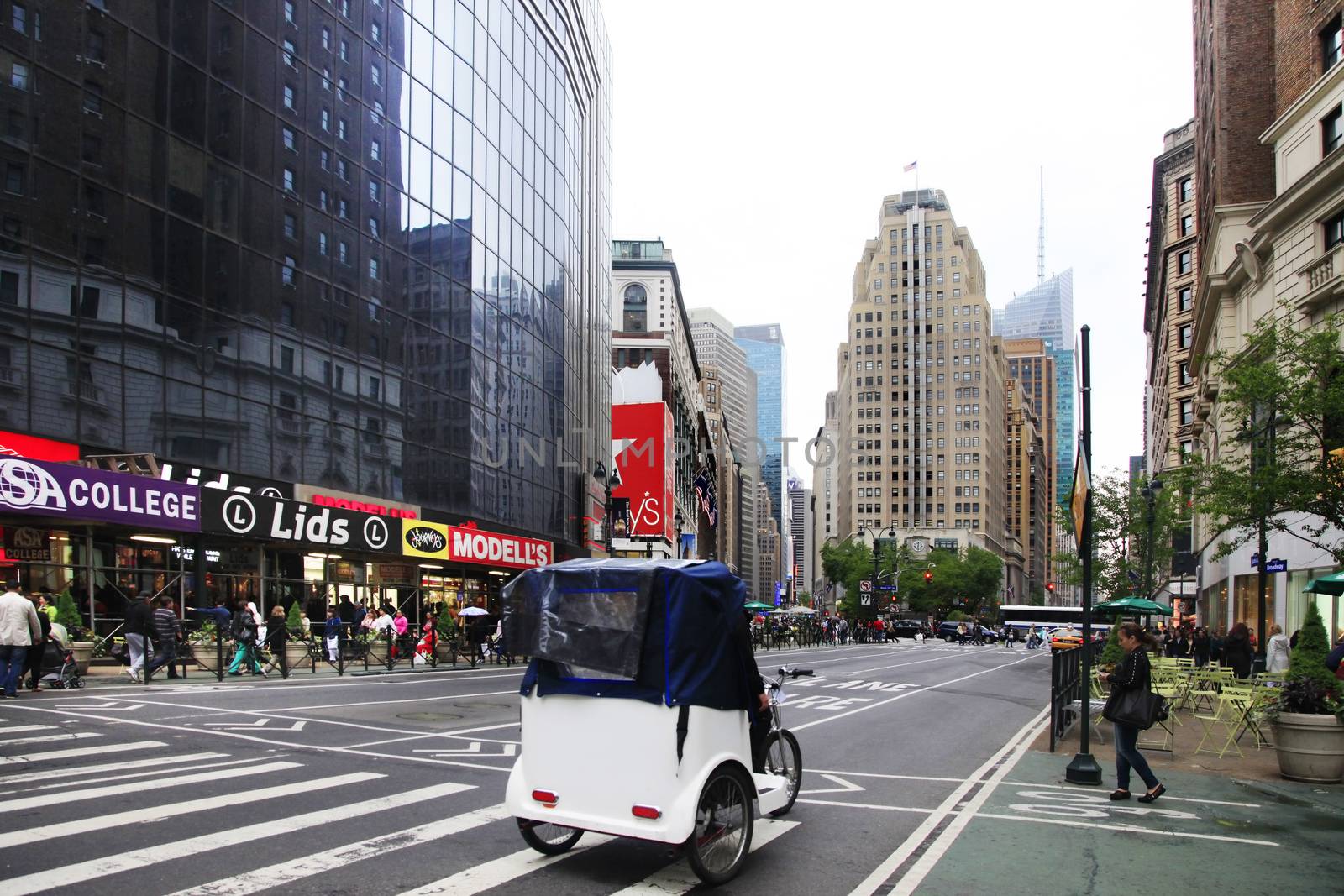 New York City, USA - May 19, 2013: rickshaw on street in Manhattan, NY. Manhattan is the most densely populated borough of New York City.