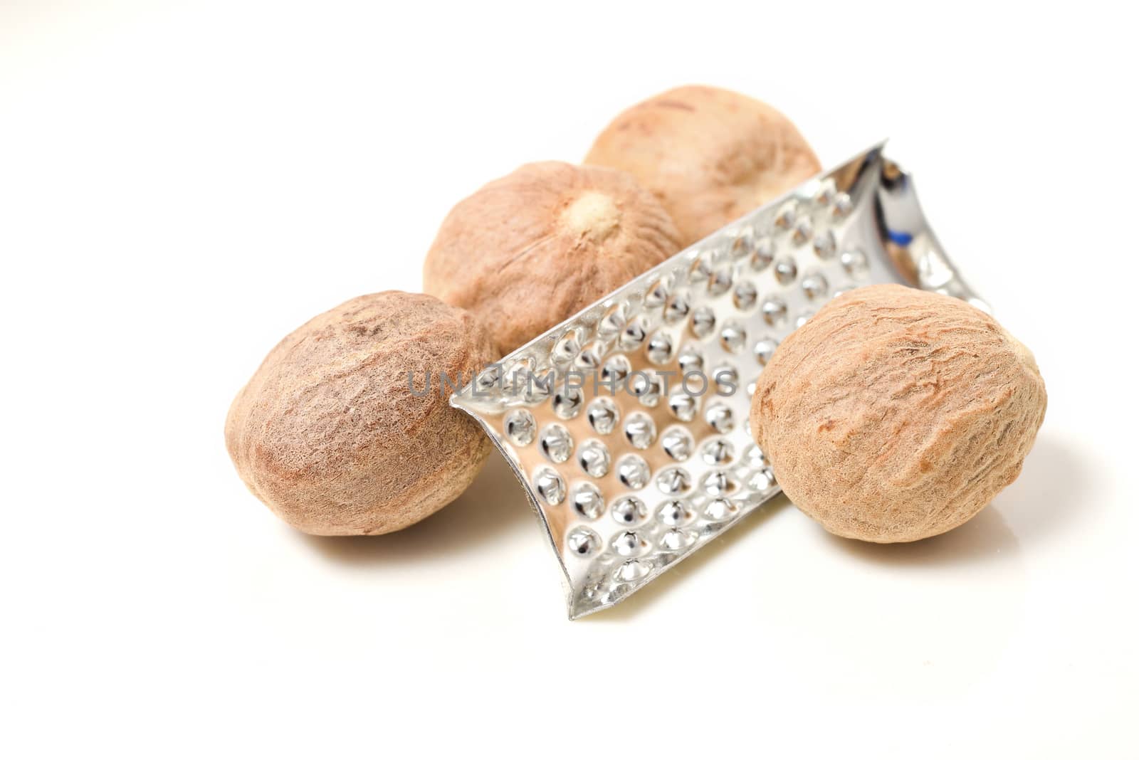 Nutmeg whole and powder isolated on white background