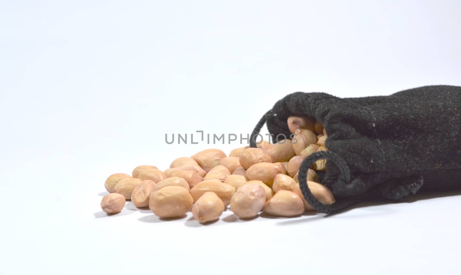 Peanuts in burlap bag isolated on white background by lakshmiprasad.maski@gmai.com