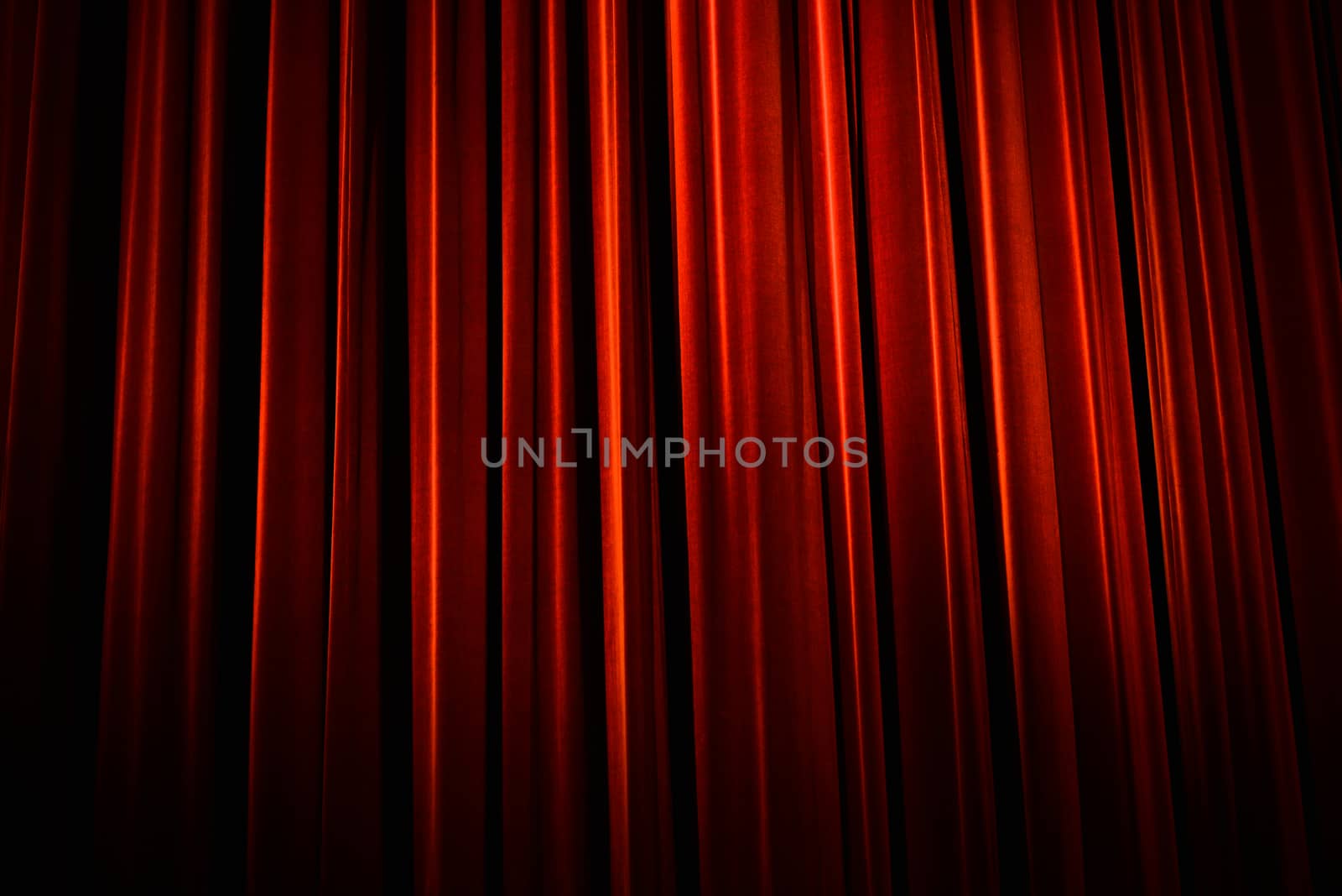 Beautiful red theater curtain with dark shadows