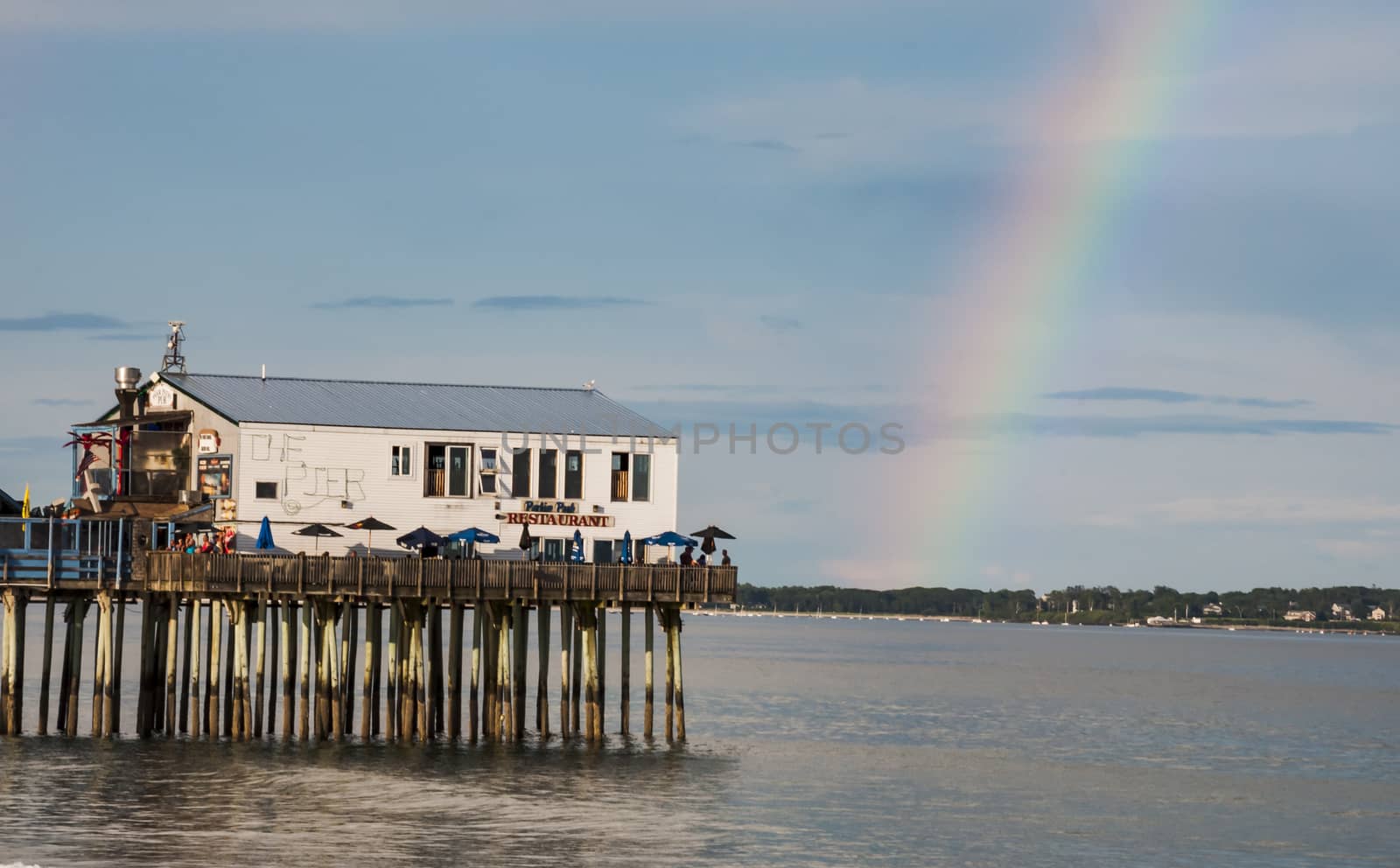 The pier and rainbow on Old Orchard Beach in Maine, Usa