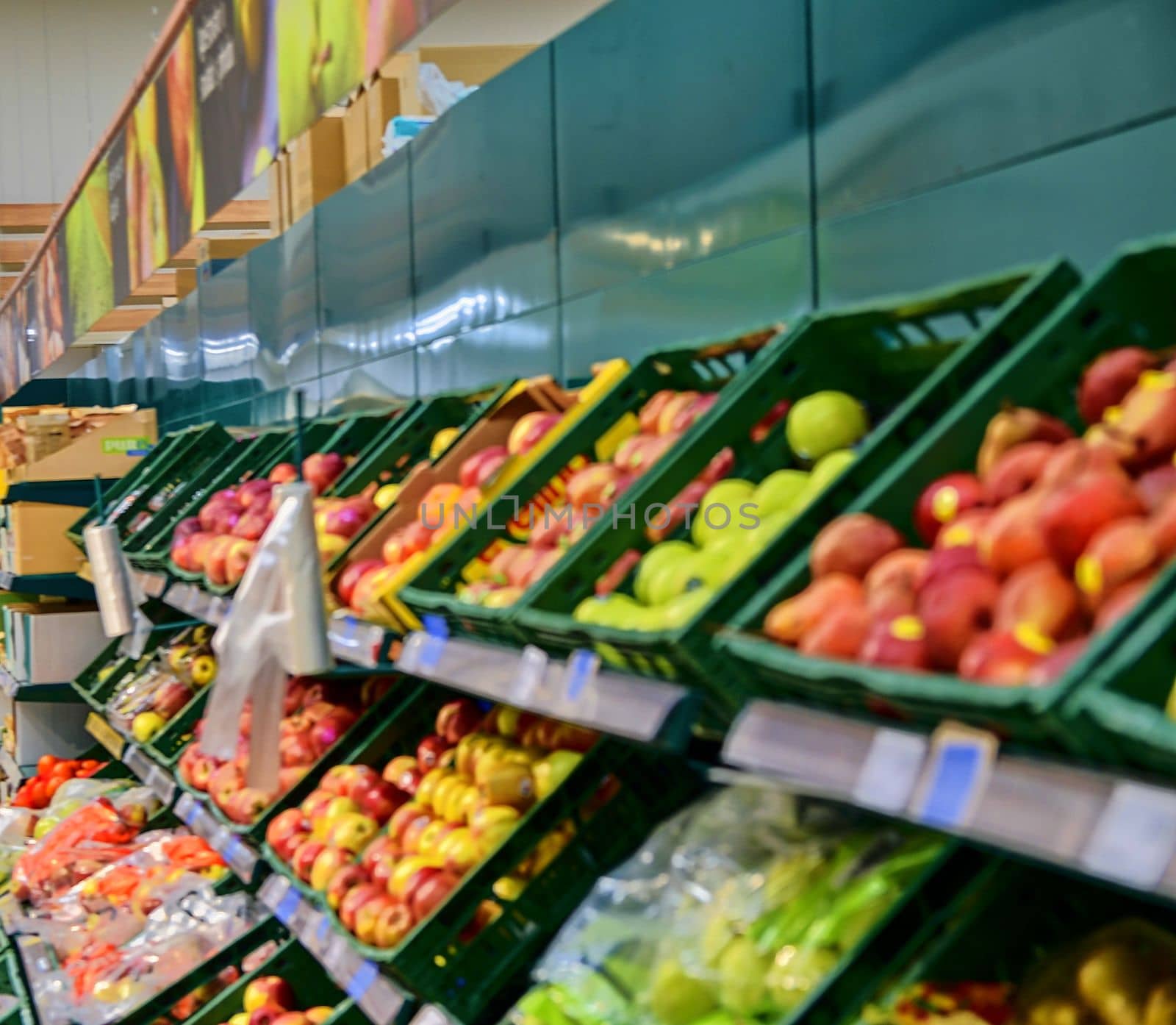 Blurred greengrocery section at retail store in Europe. Greengrocery in local supermarket, defocused background by roman_nerud