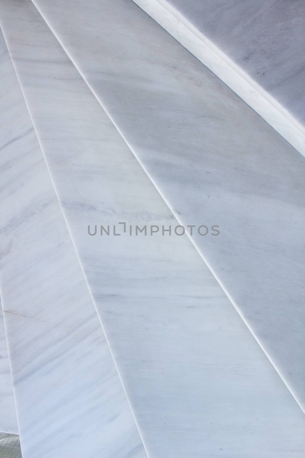 Close-up view of geometrical pattern background of light gray stone marble stairs