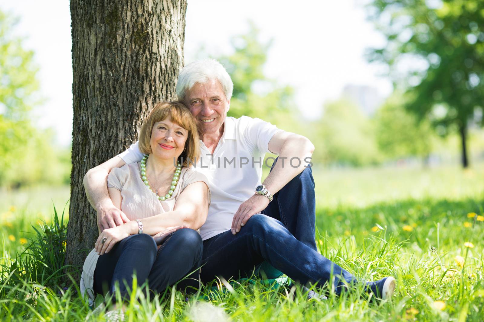 Happy Mature couple in the park in summer day