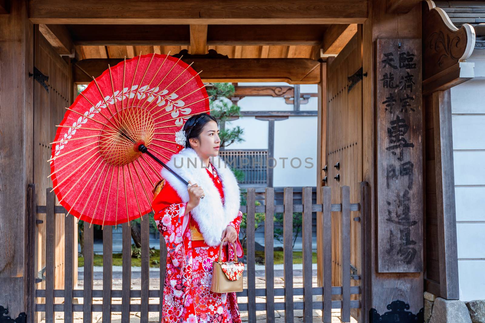 Asian women wearing japanese traditional kimono visiting the beautiful in Kyoto.