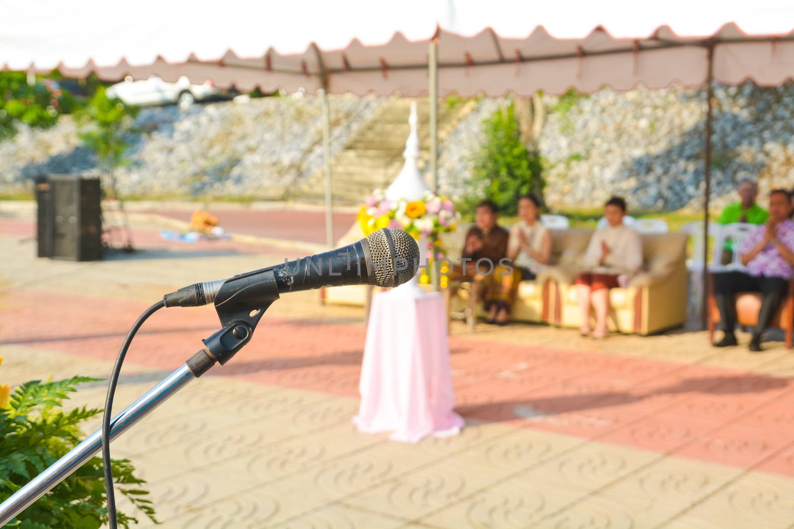 Close up of Microphone over the Podium in the morning Event by thampapon