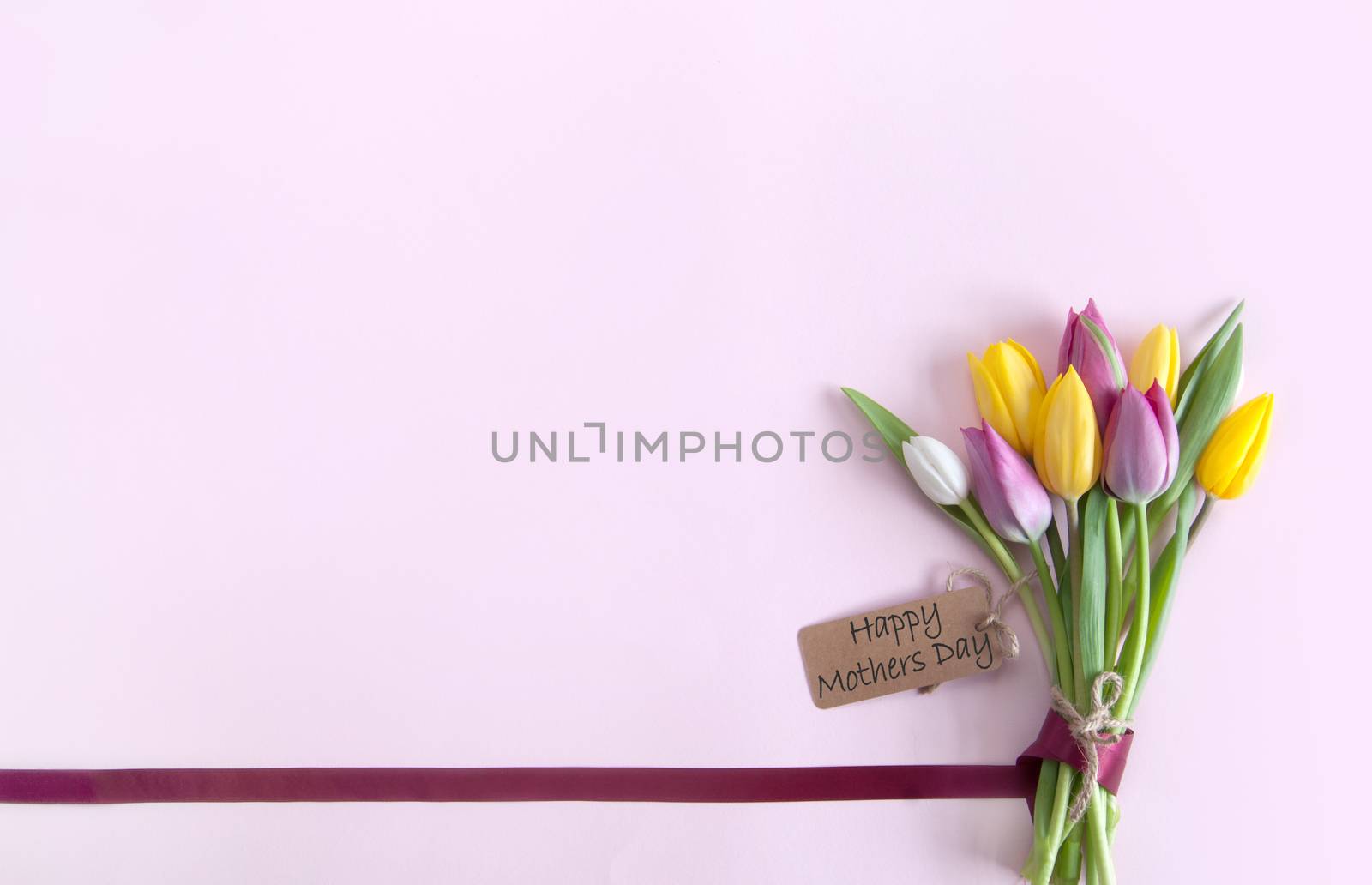 Silk ribbon attached to a bunch of flowers with label