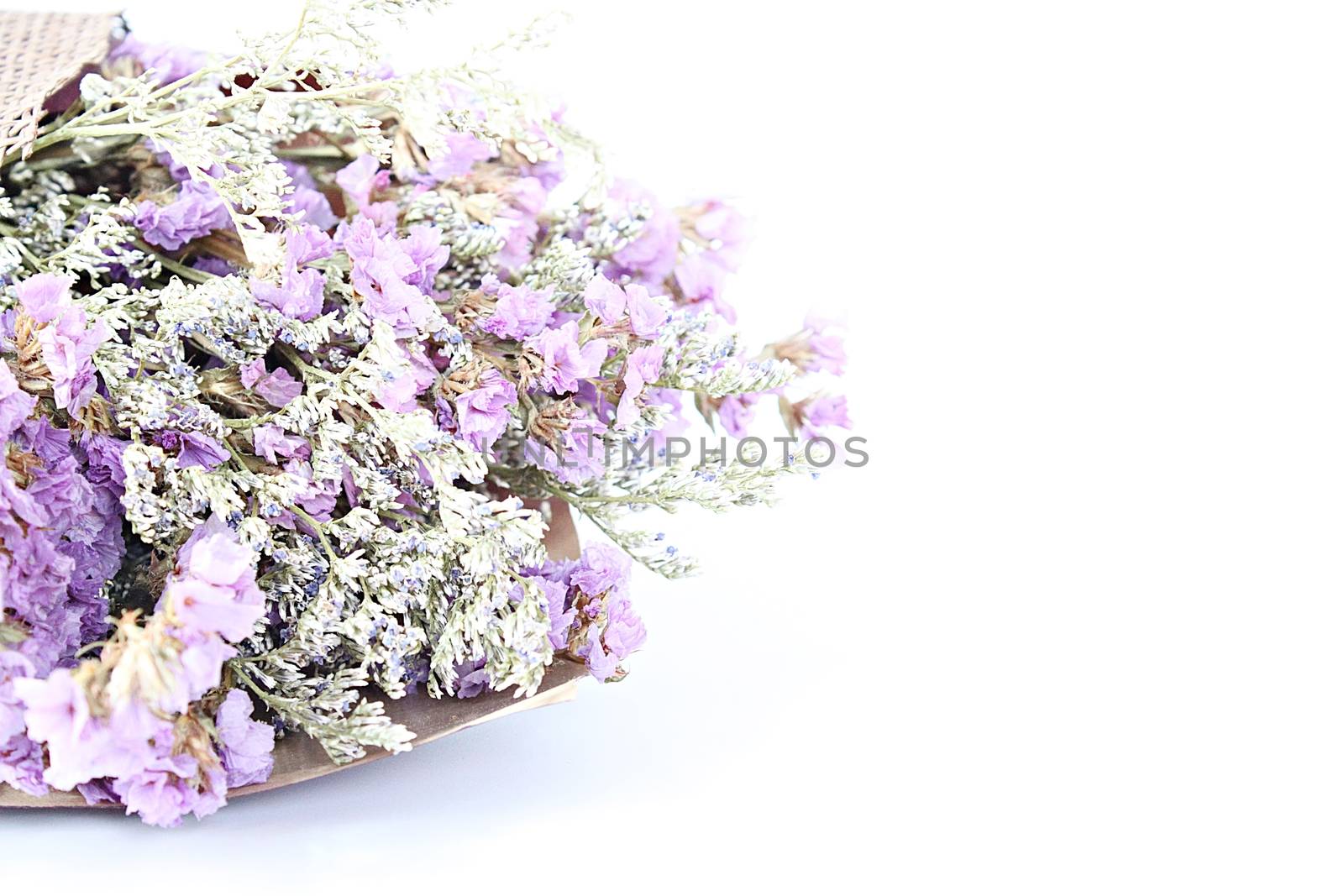 Bouquet of dried wild flowers on white background with copy space by sureeporn