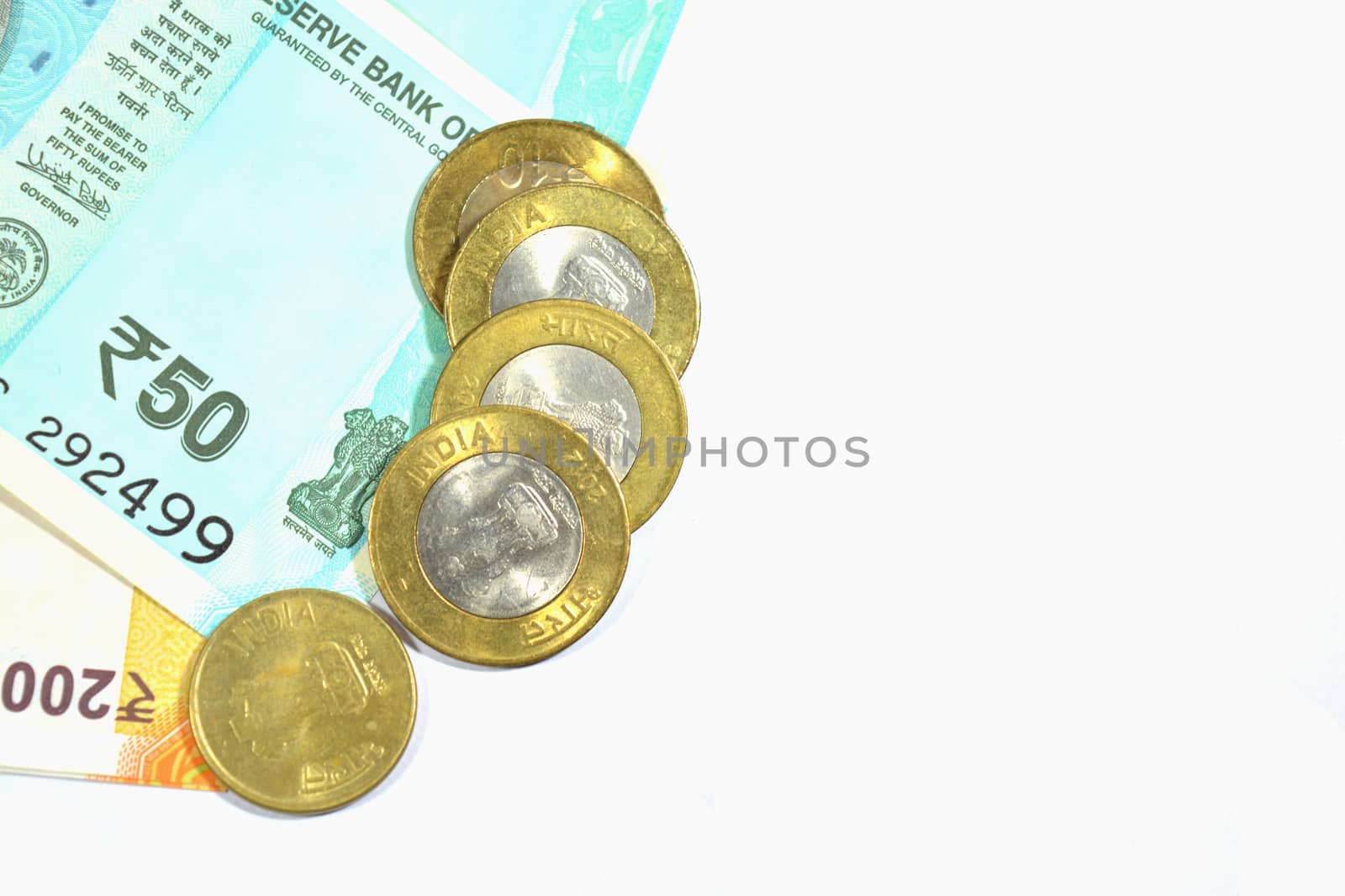 New Indian 50 and 200 rupees with 10 rupees coin on white isolated background.