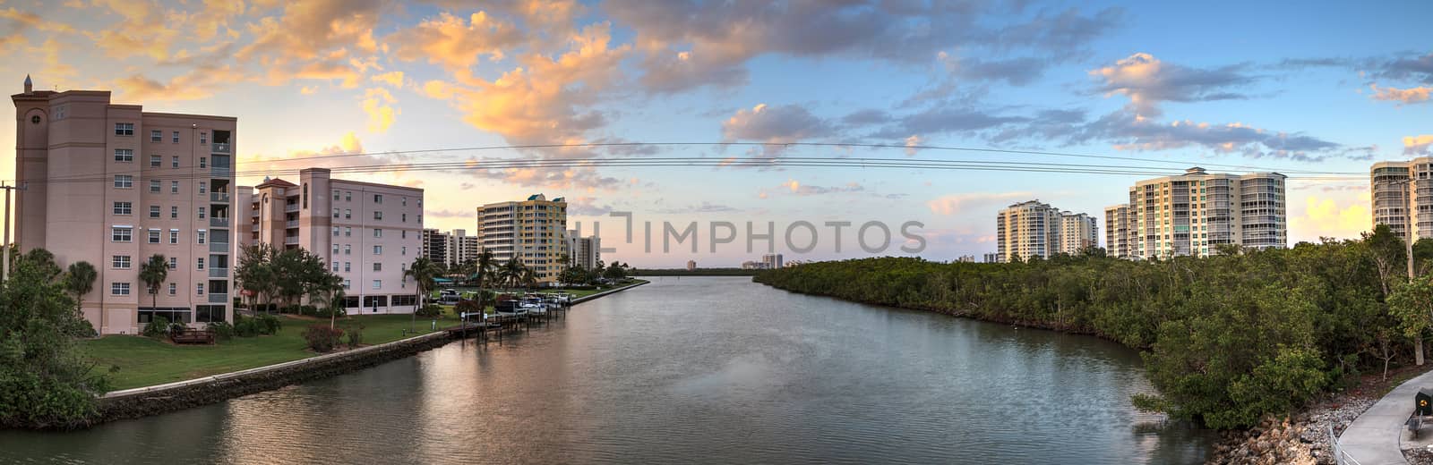 Sunset sky and clouds over the Vanderbilt Channel river near Delnor-Wiggins Pass State Park and Wiggins Pass in Naples, Florida
