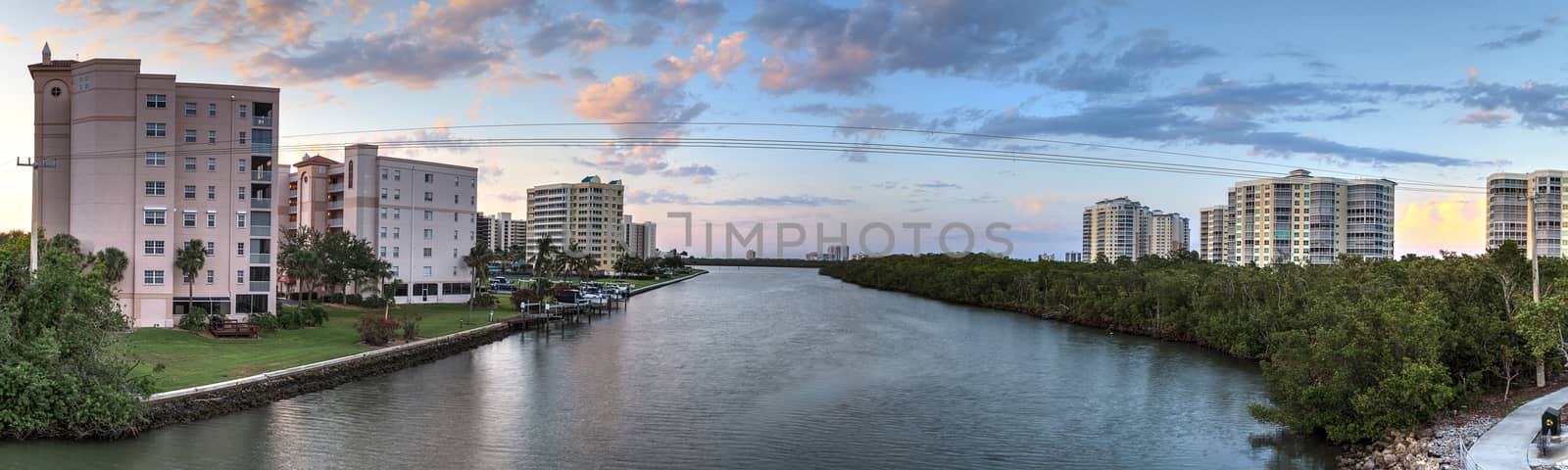 Sunset sky and clouds over the Vanderbilt Channel river near Delnor-Wiggins Pass State Park and Wiggins Pass in Naples, Florida