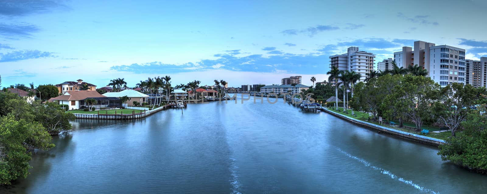 Sunset sky and clouds over the Vanderbilt Channel river near Delnor-Wiggins Pass State Park and Wiggins Pass in Naples, Florida