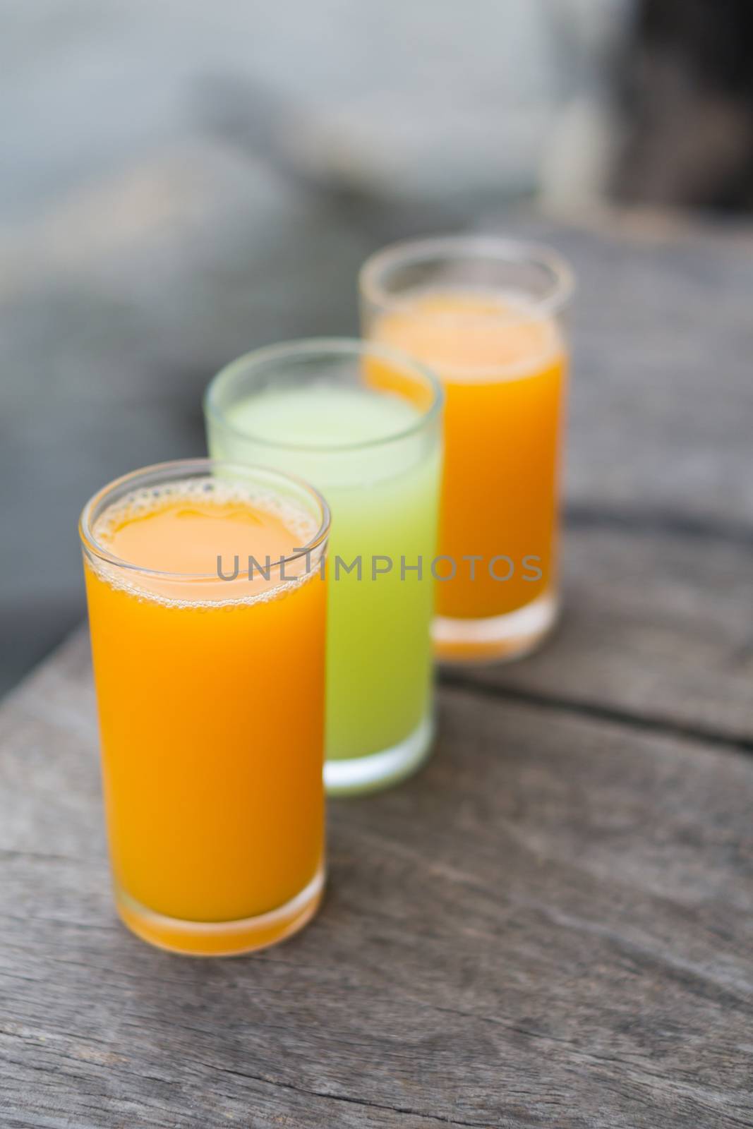 Orange and guava juice on wood background, drink for healthy con by pt.pongsak@gmail.com