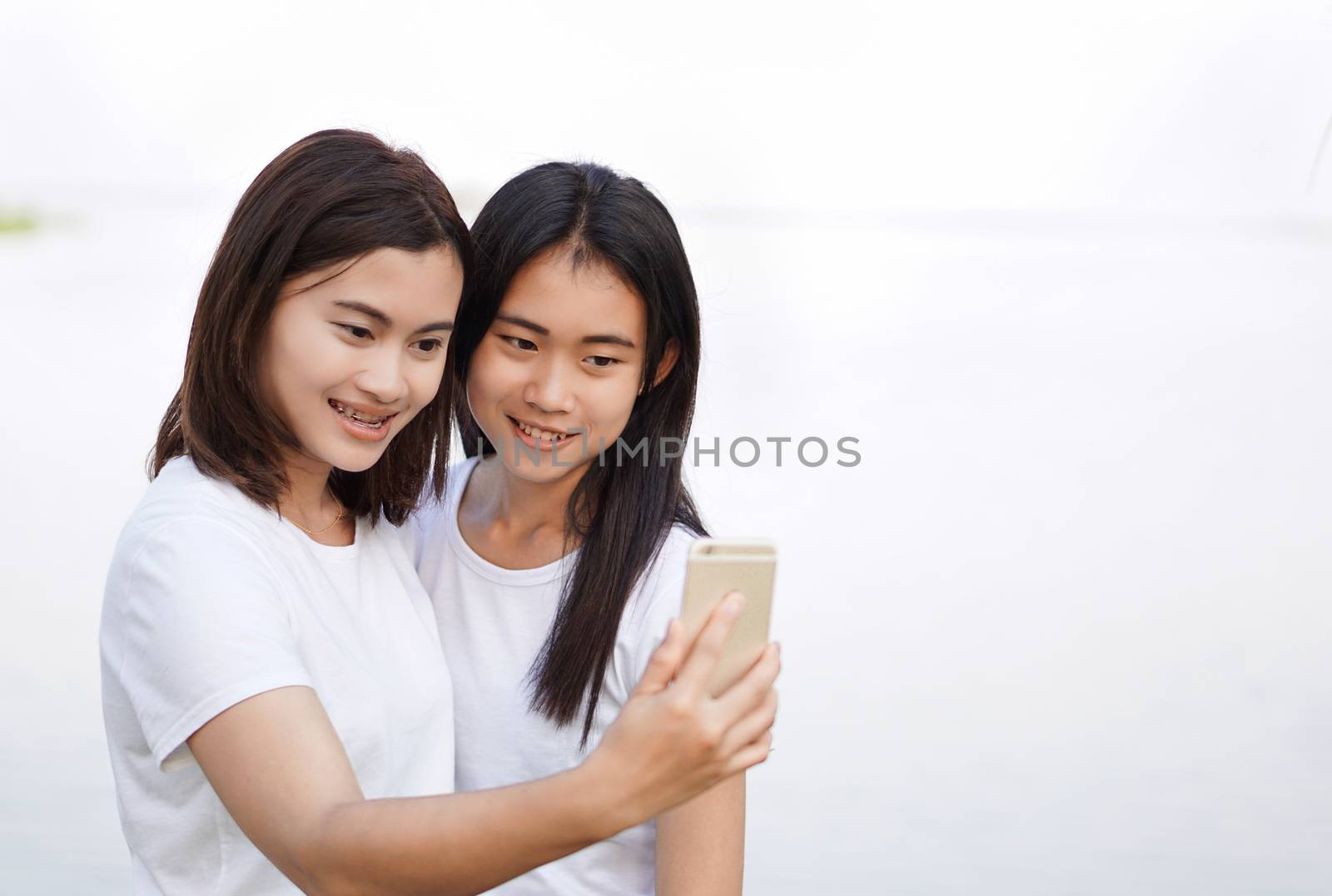 Young asian woman selfie with smile and happy feelling, selective focus