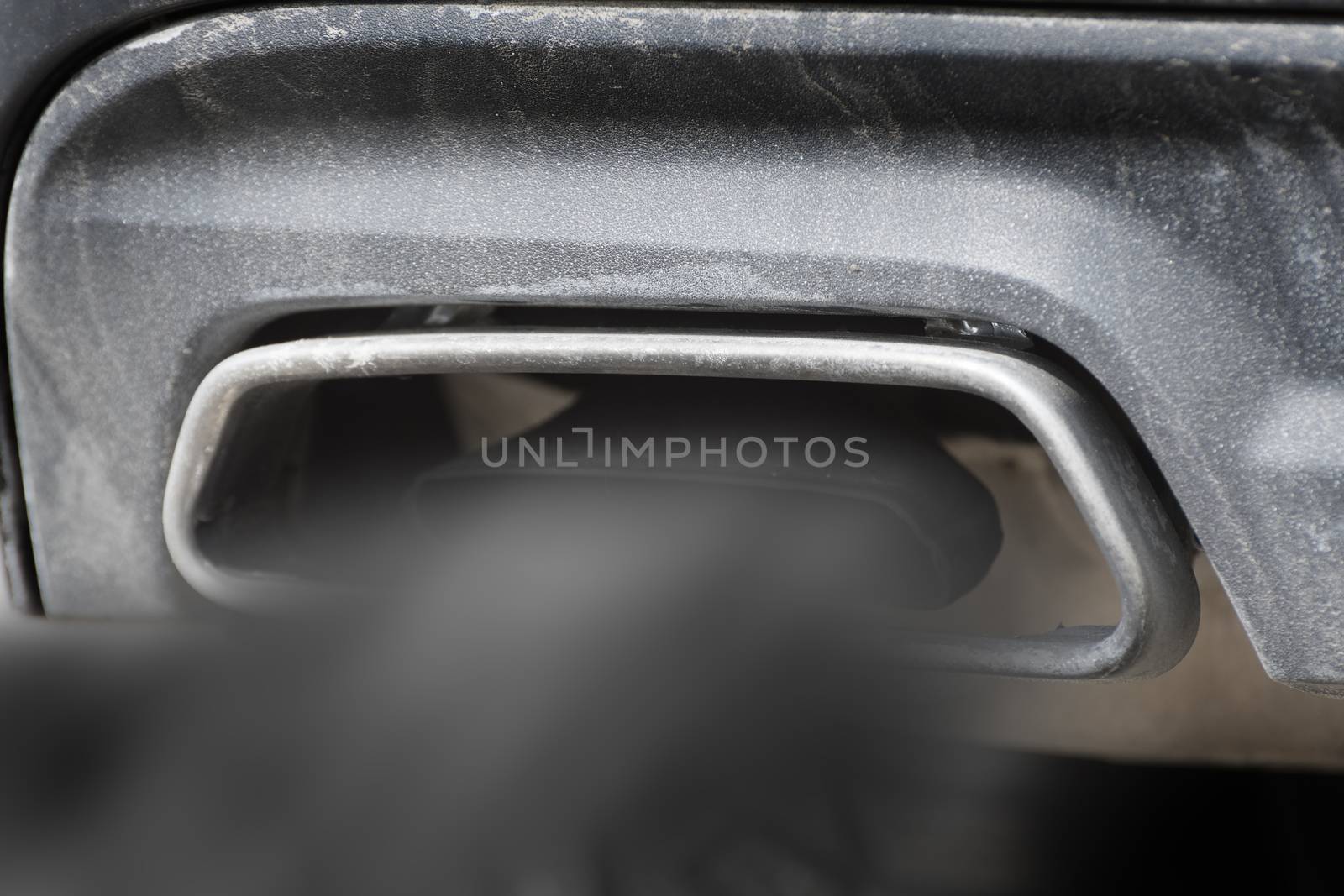 Close image of a car exhaust