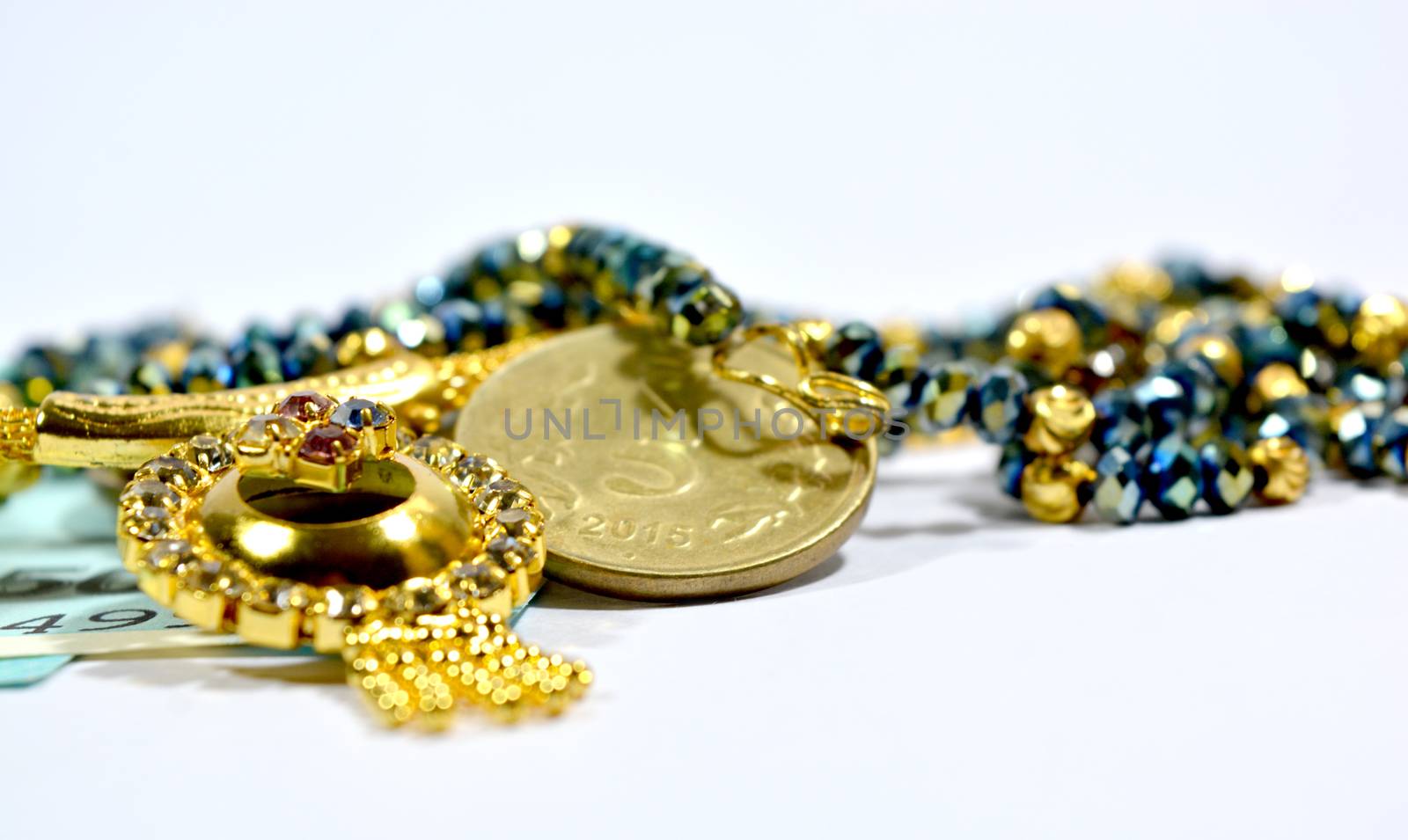 New indian 50 Rupees currency and 10 rupess Coinswith jewellery on isolated background by lakshmiprasad.maski@gmai.com