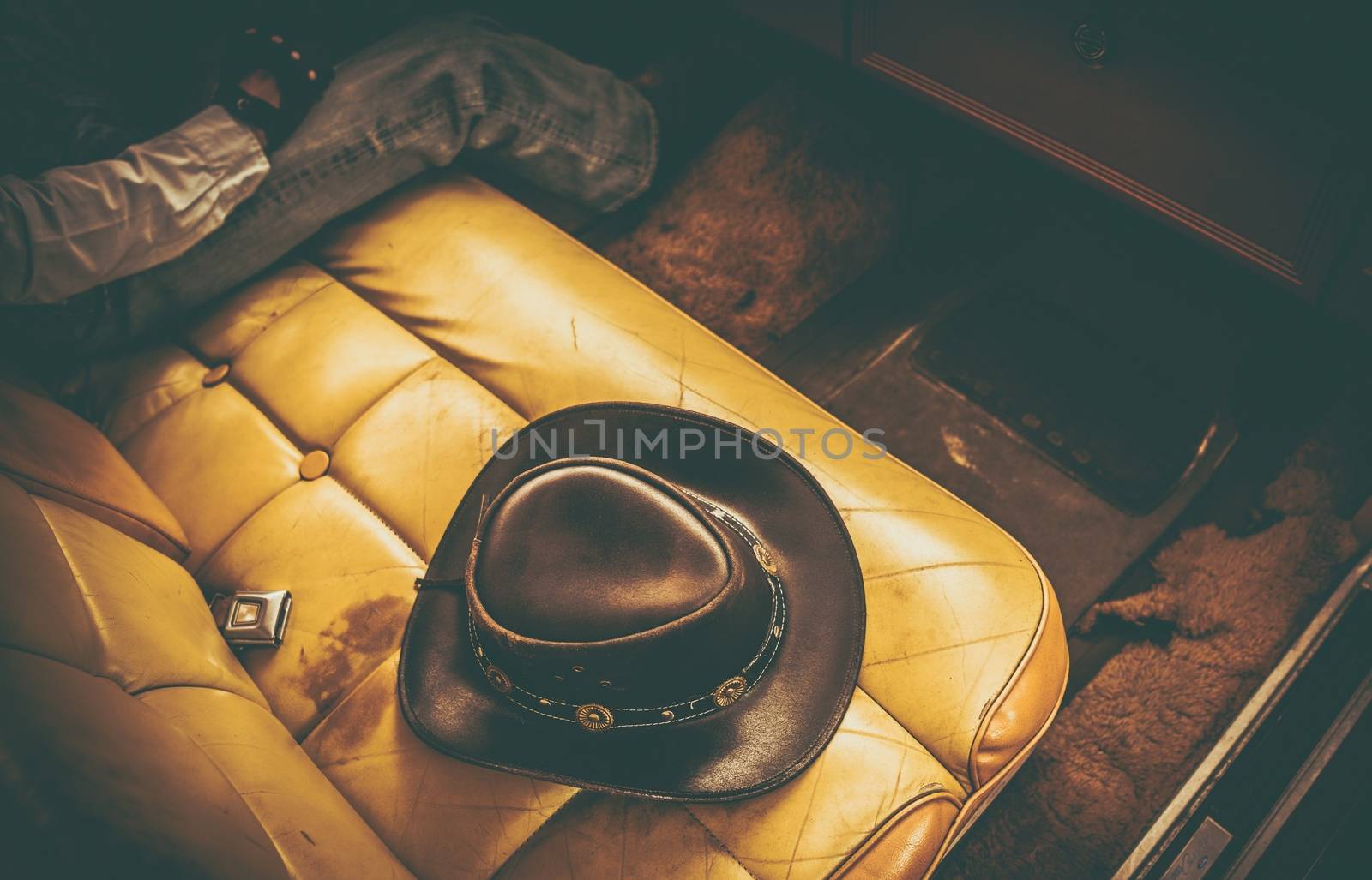 Cowboy Classic Ride. Leather Cowboy Hat on the Seat of Vintage Car.