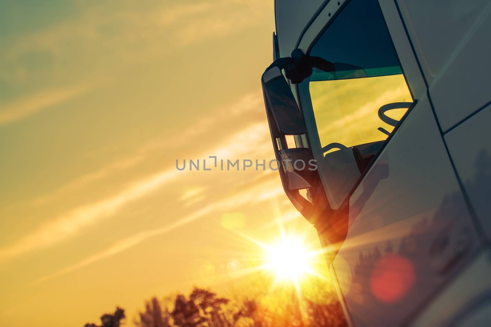 Semi Truck Transport Concept Photo. Semi Truck Cabin and the Sunlight.