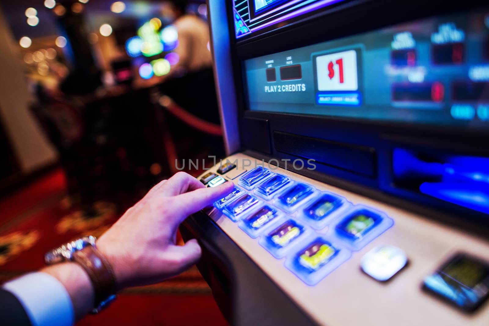 Caucasian Men Playing Casino Slot Machine. Closeup Photo.