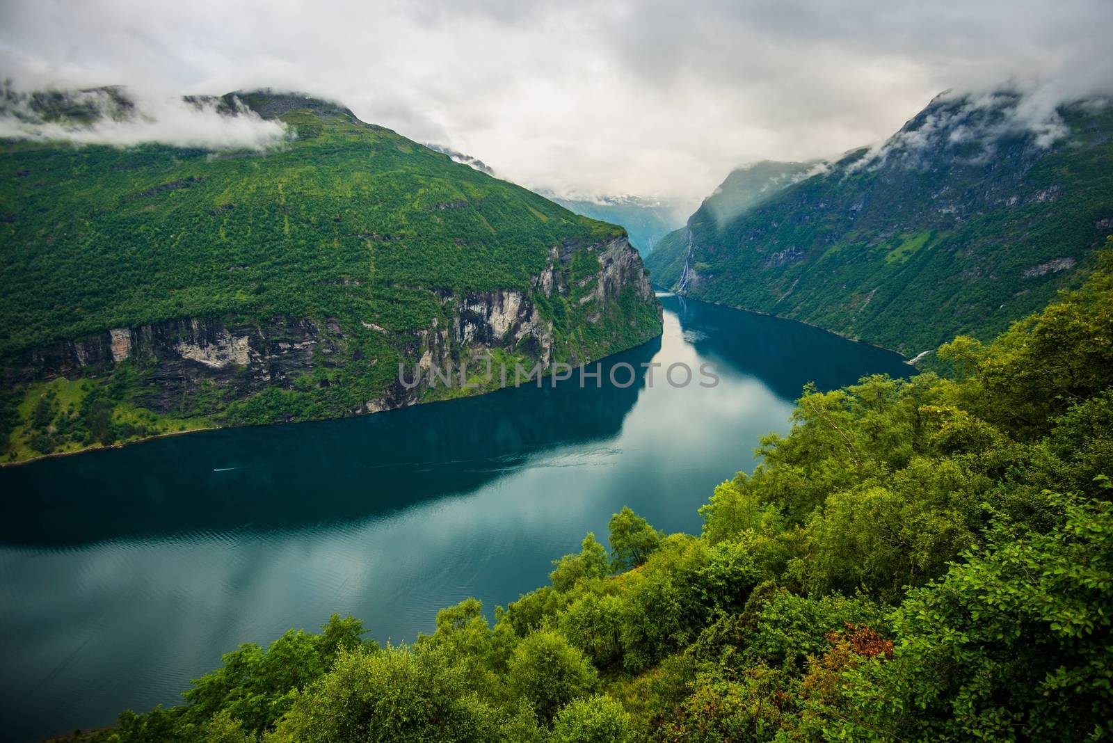 Scenic Norwegian Fjord Landscape During Cloudy Summer Day. 