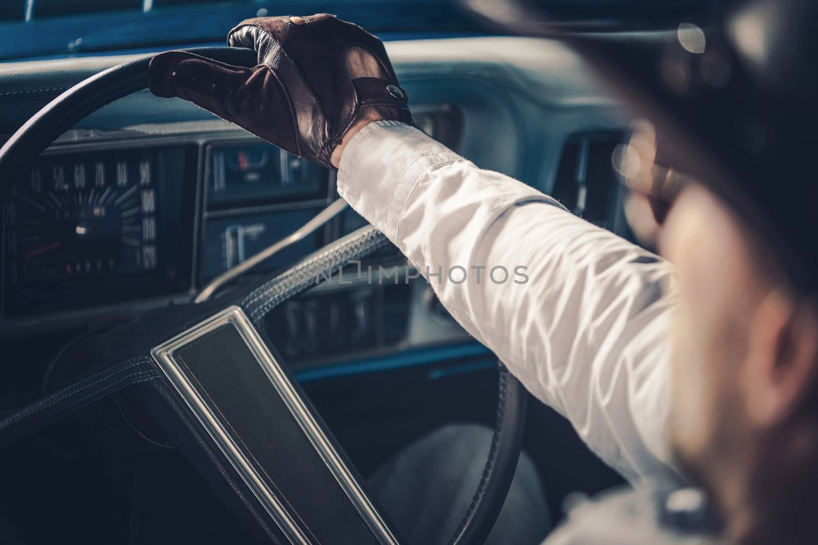 American Retro Car Driving. Caucasian Men on the Road Trip in His Classic Muscle Car.