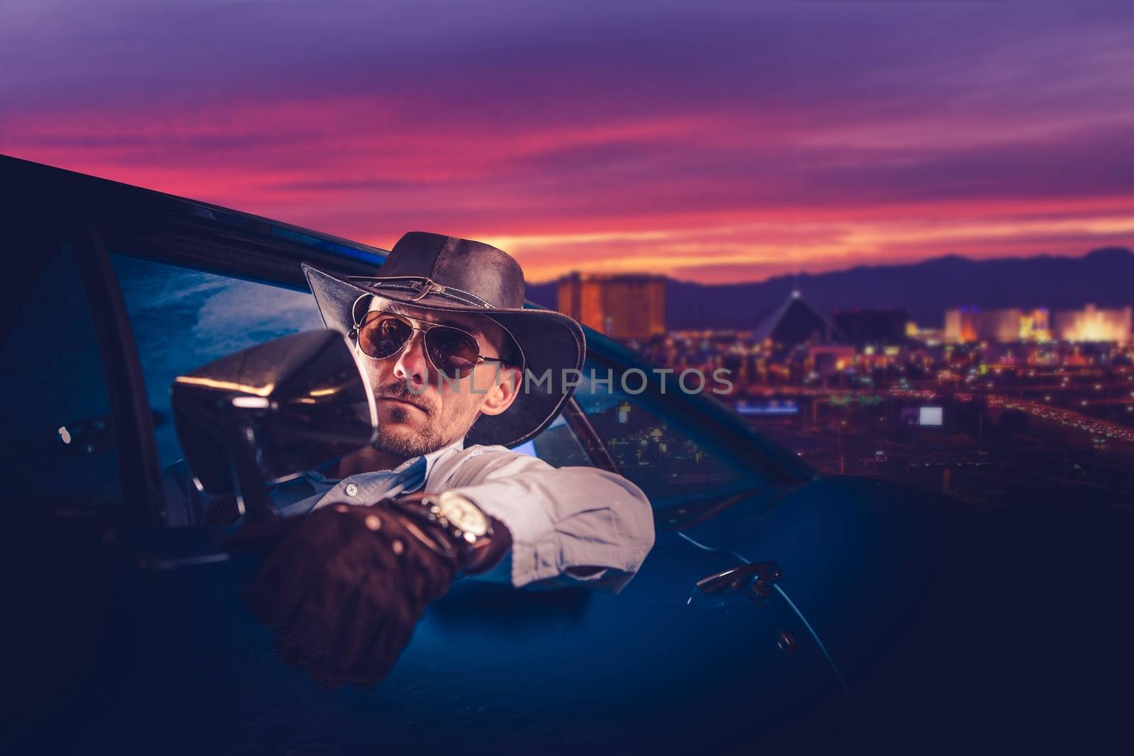 Cowboy Leaving Las Vegas. Caucasian Men in His 30s in Western Wear and Cowboy Hat Inside His Classic Muscle Car Ride.