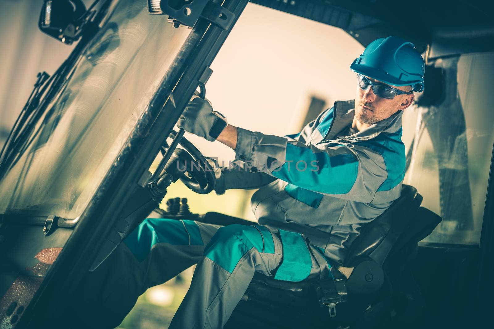 Forklift Truck Caucasian Operator in His 30s. Industry Equipment Theme.