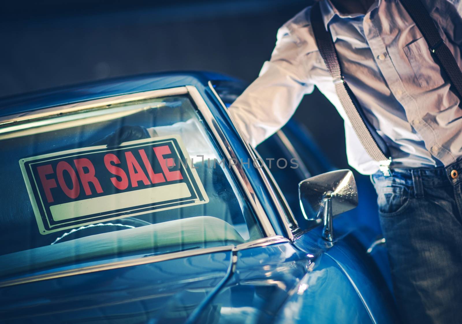 Men Putting For Sale Sign Under His Car Windshield. Selling Car Theme.