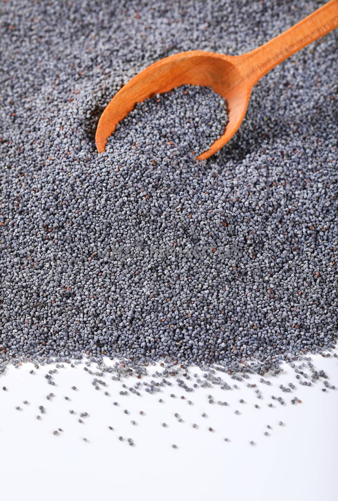 bulk poppy seeds and wooden spoon