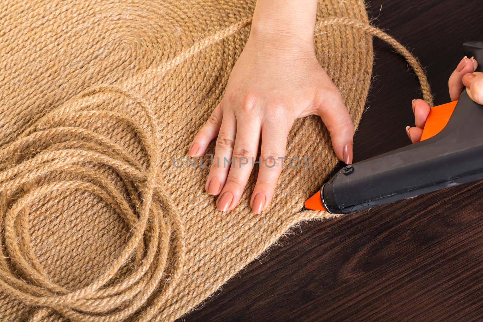 making handmade carpets from a rope close-up