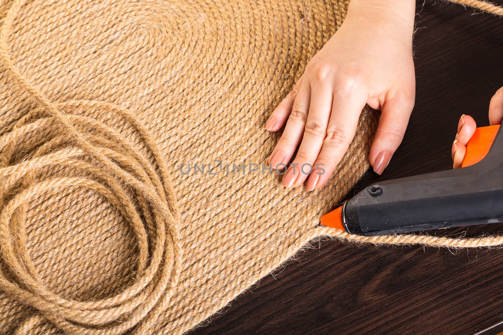 making handmade carpets from a rope close-up