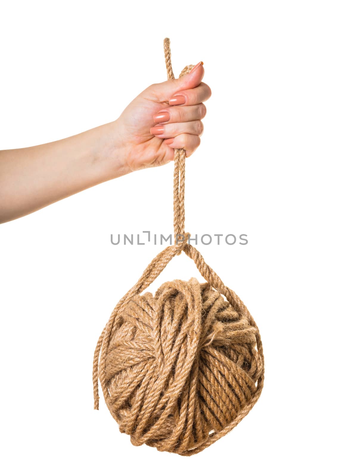 in a female hand tangle of rope on white isolated background