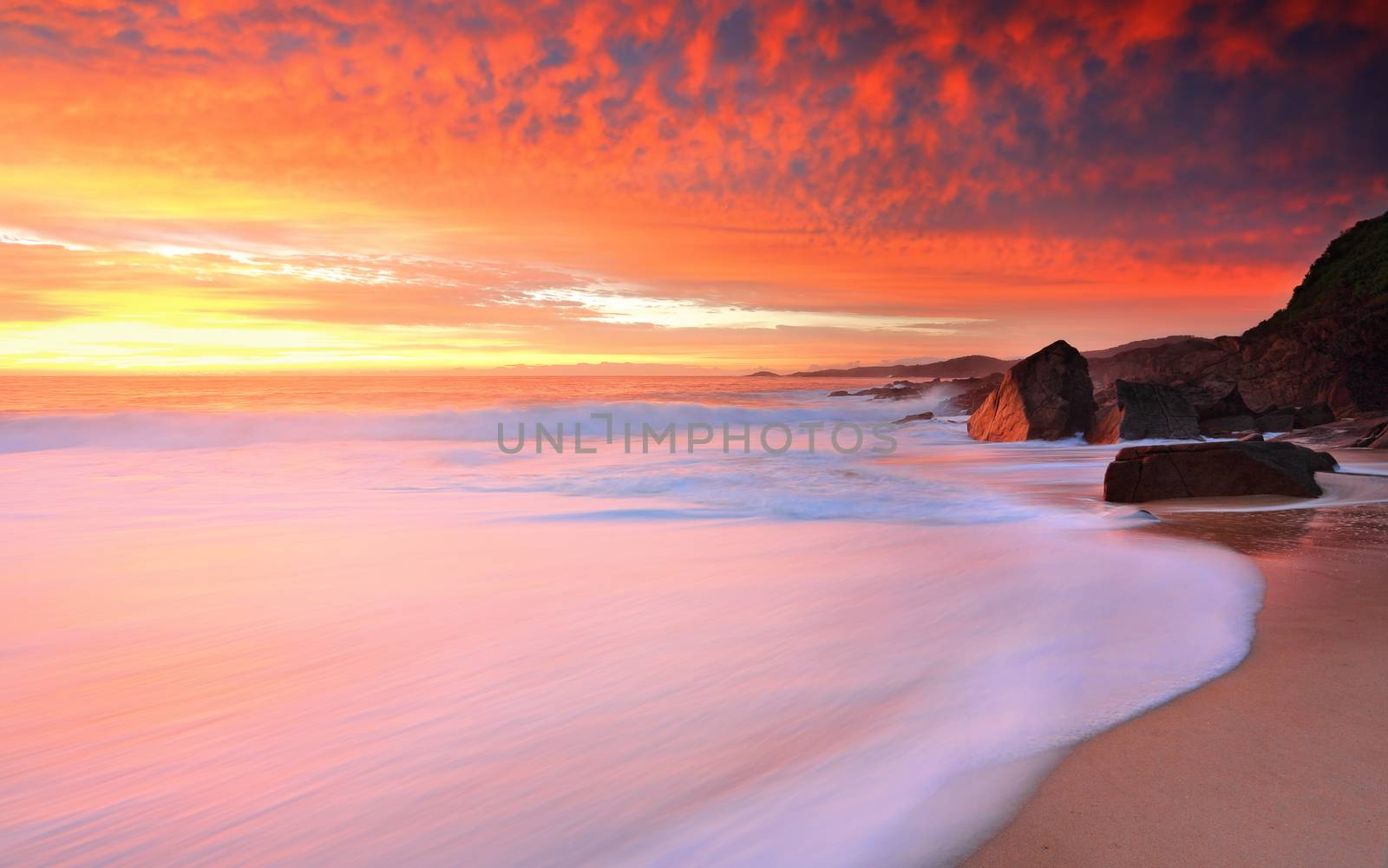 Foamy white seas and vivid sunrise by lovleah