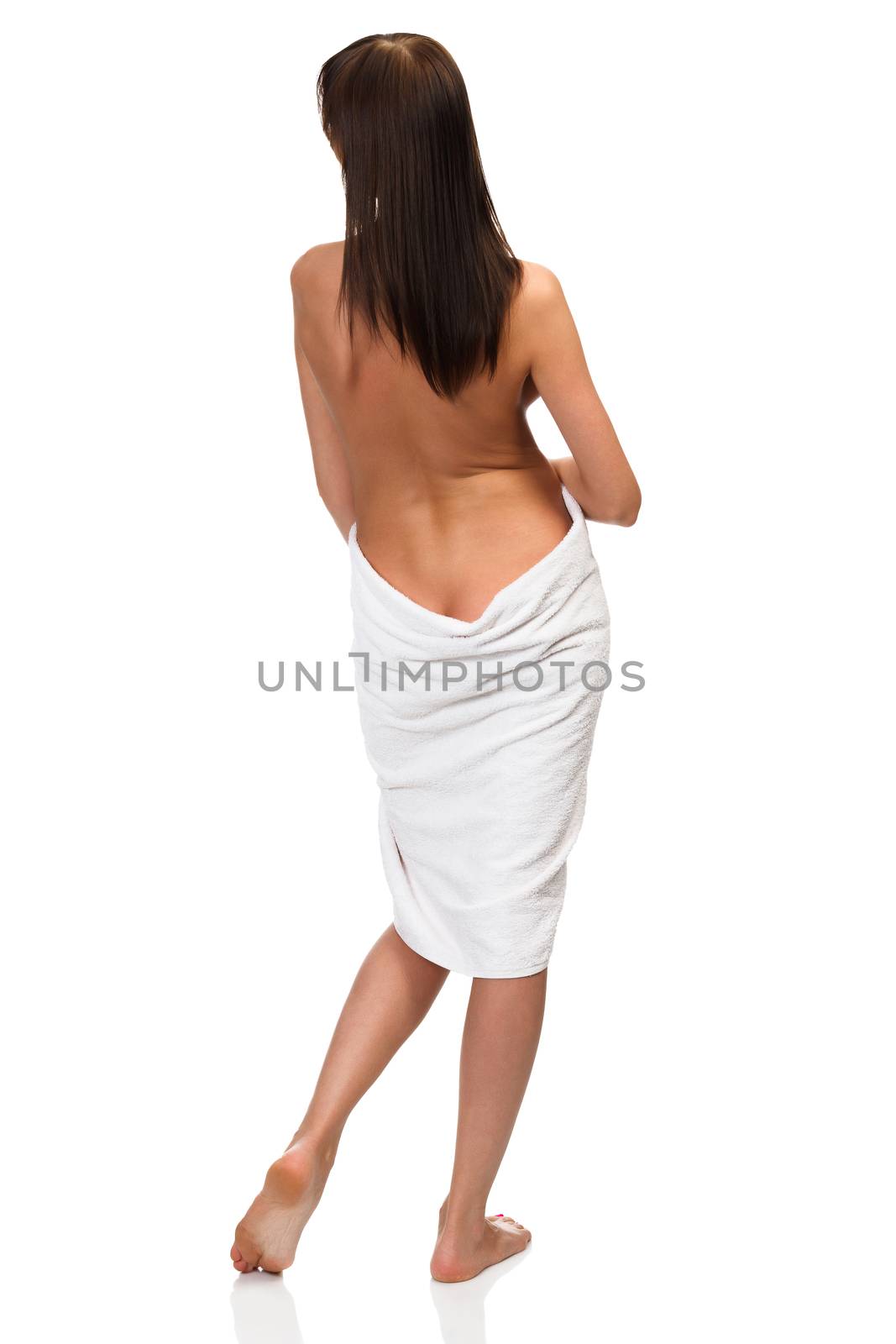 Sexy naked woman wrapped in white towel isolated on white background