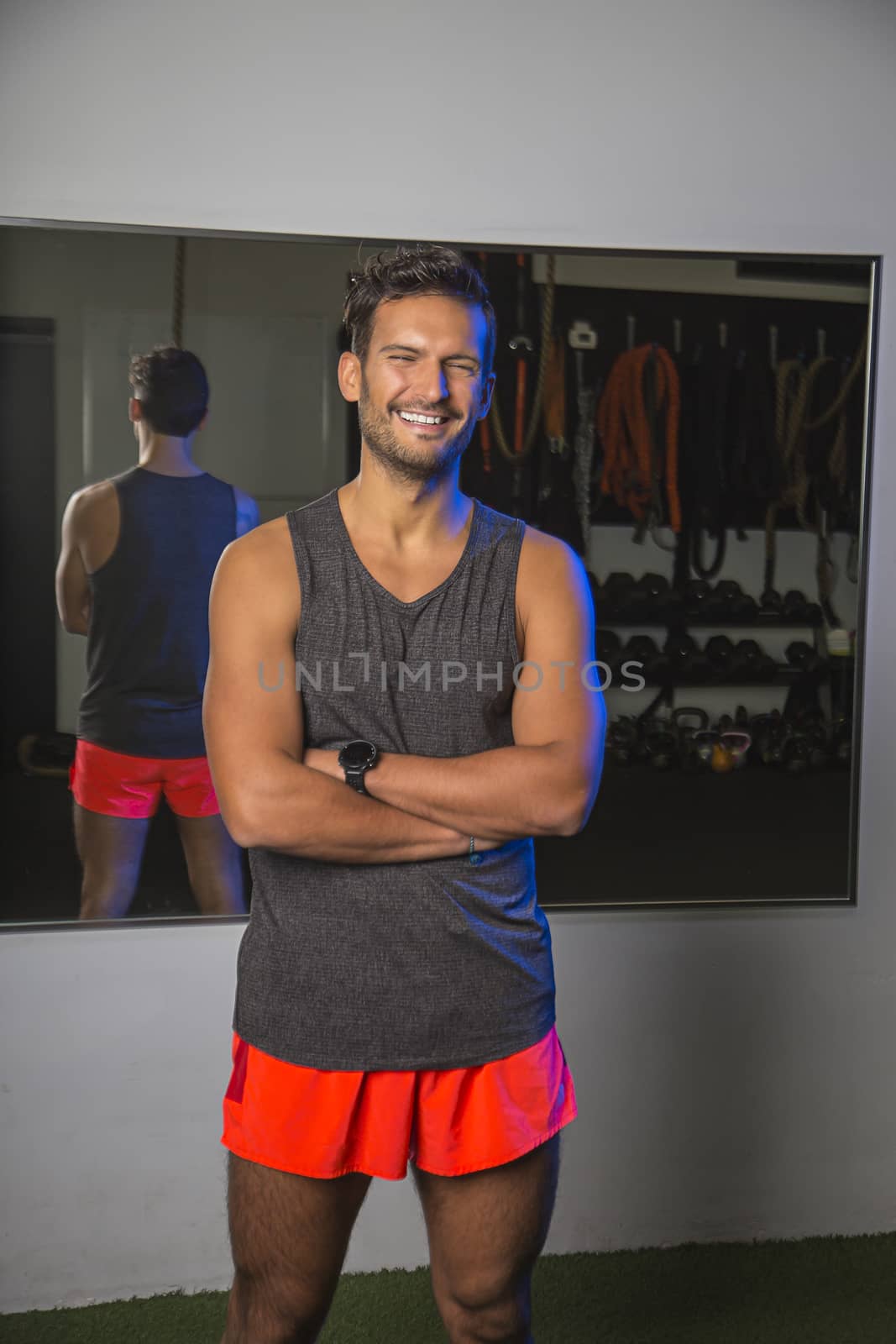 Smilling man in a gym by mypstudio