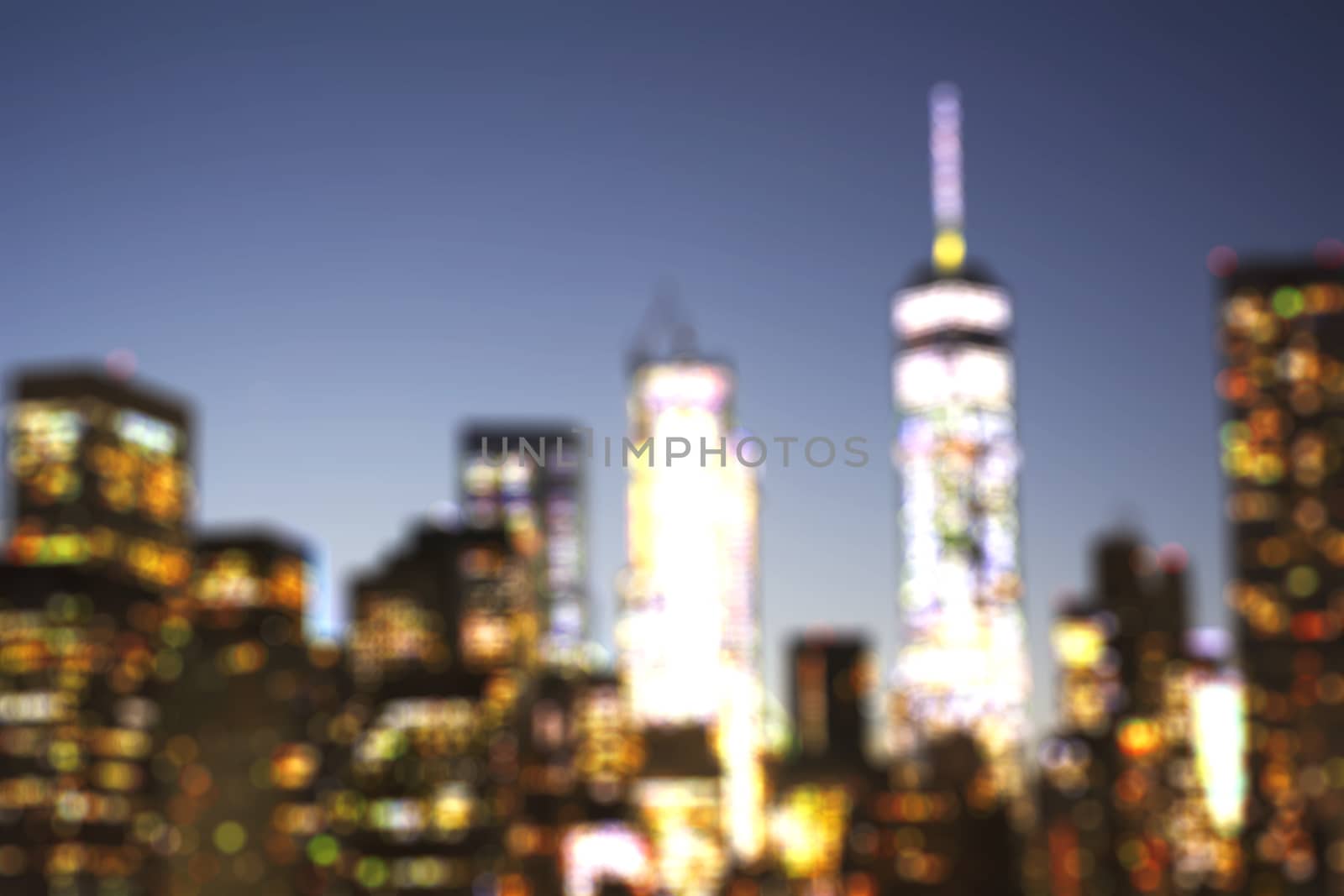 Defocused view of New York City skyline downtown from Brooklyn at evening