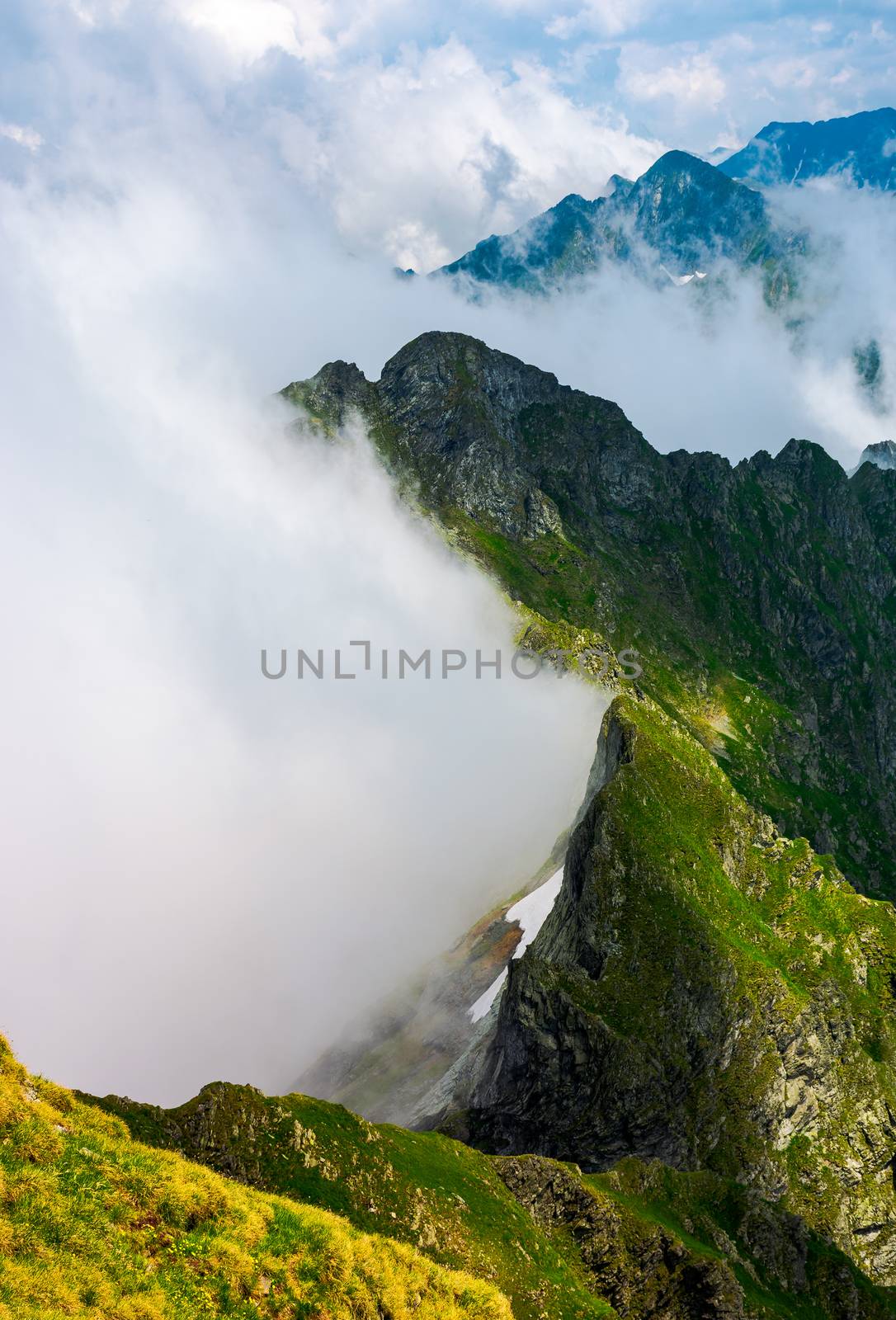 clouds rising in Fagaras mountains by Pellinni