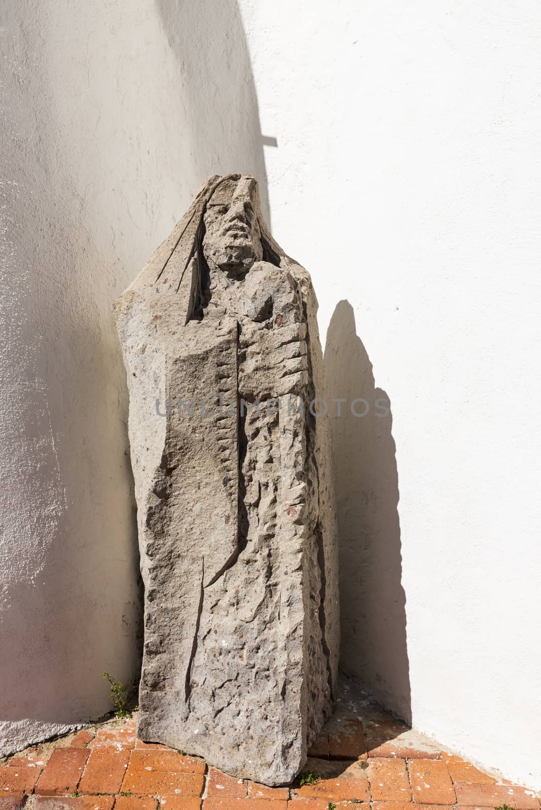 very old statutue in front of the church Stella Maris in Porto Cervo, Costa Smeralda, Sardinia, Italy, in the famous place of porto cervo where the rich and famous travel in summer
