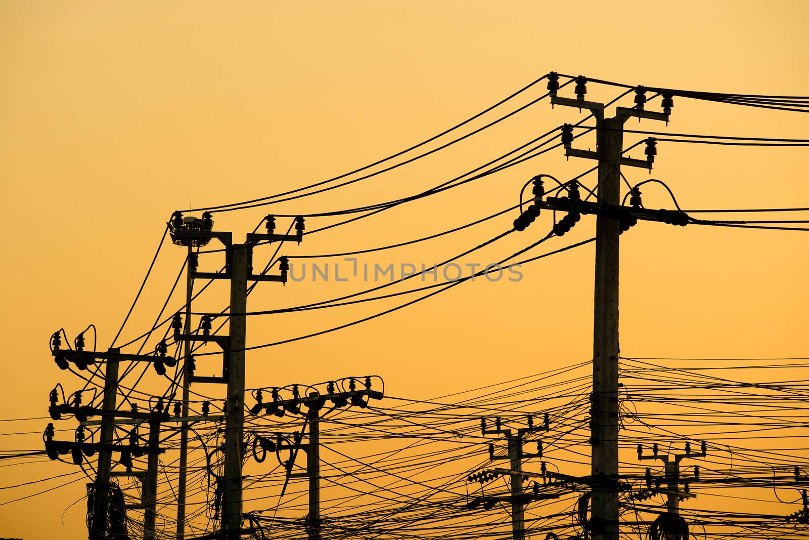 electricity pole and messy wire cable at twilight