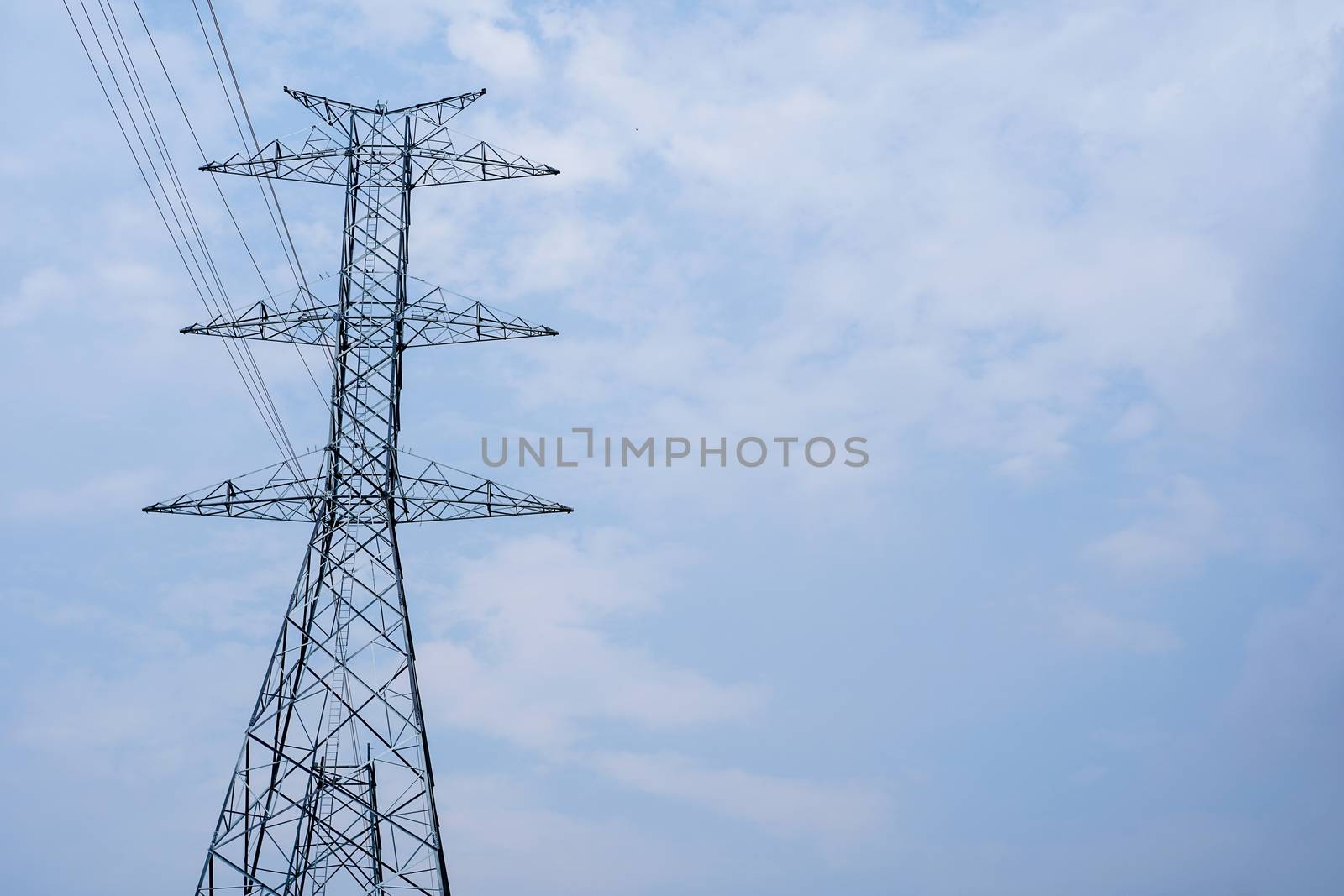 high voltage tower on sky background