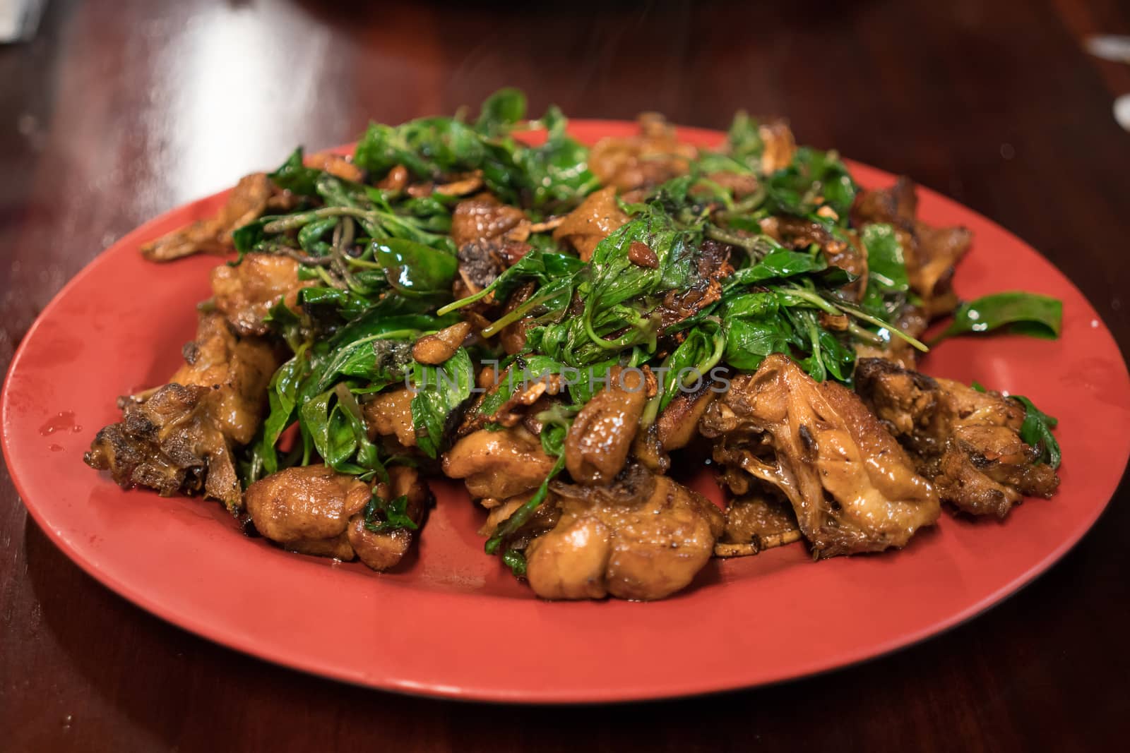 Taiwanese stirfry chicken with basil dish called 3 cups chicken.