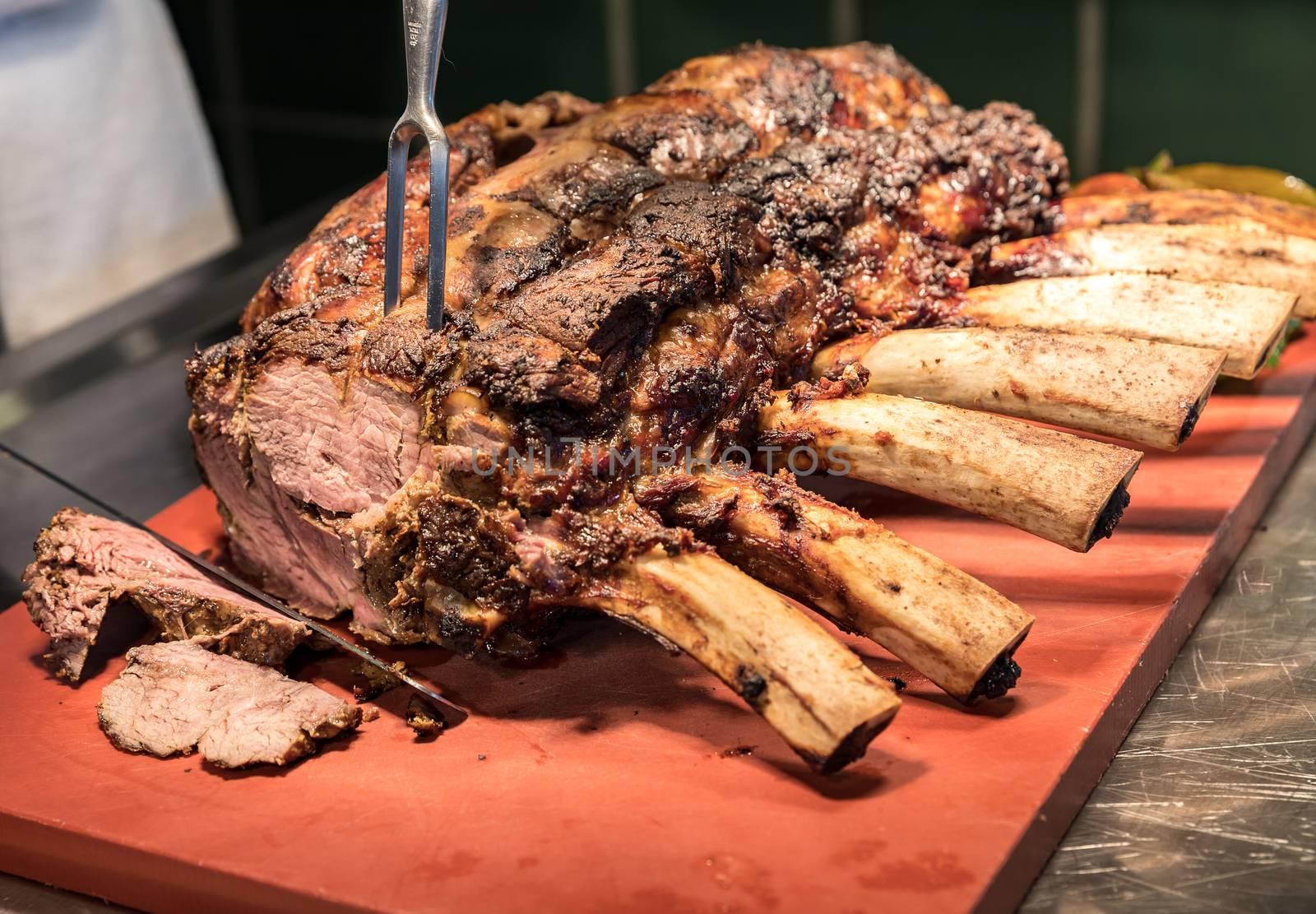 Chef Carving prime rib of  roast Wagyu beef 