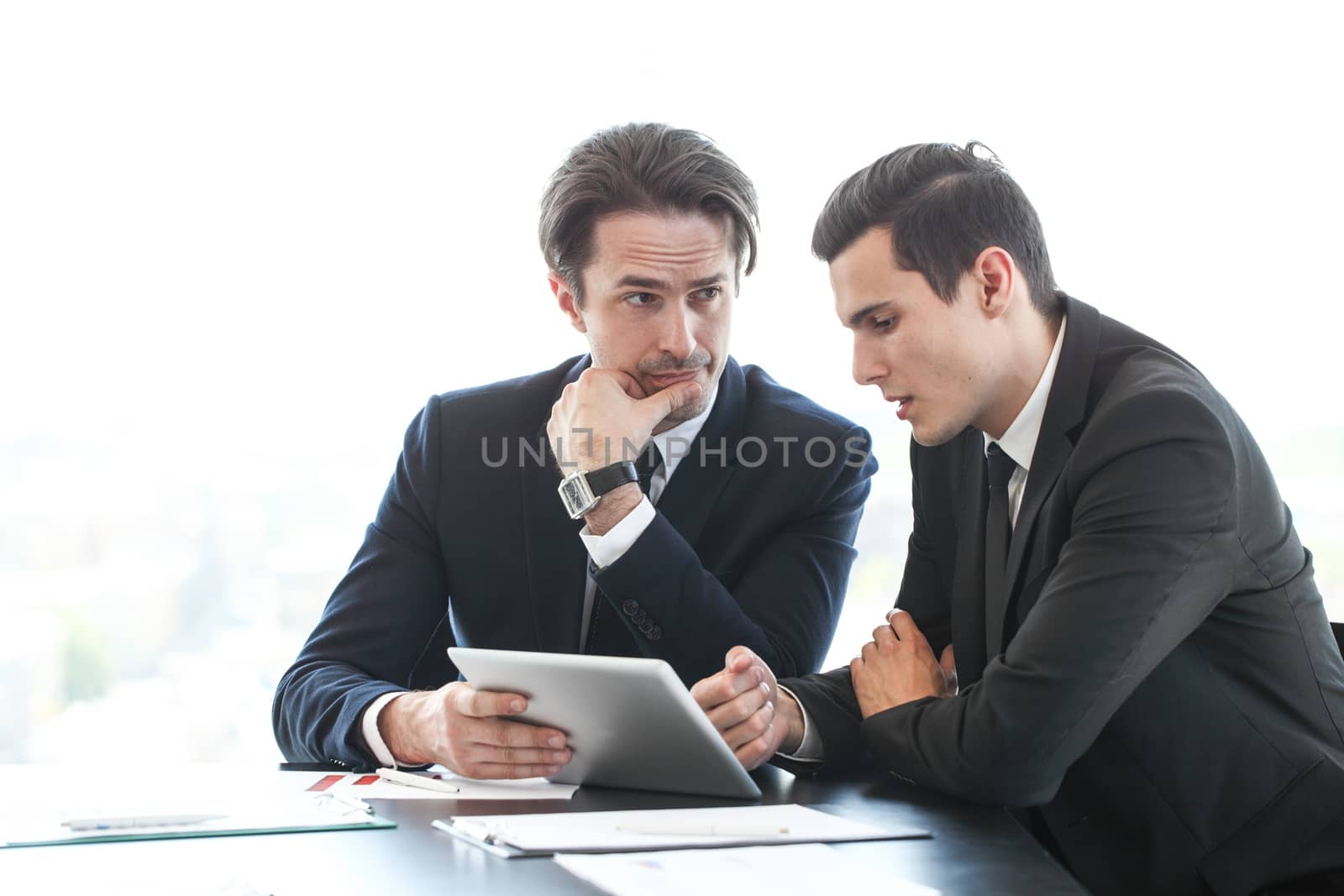 Business people using tablet pc together at office