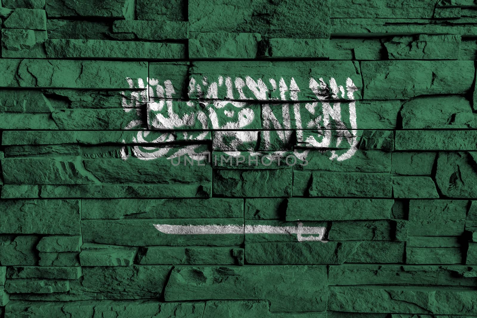 Saudi Arabia flag painting on high detail of old brick wall by stockdevil