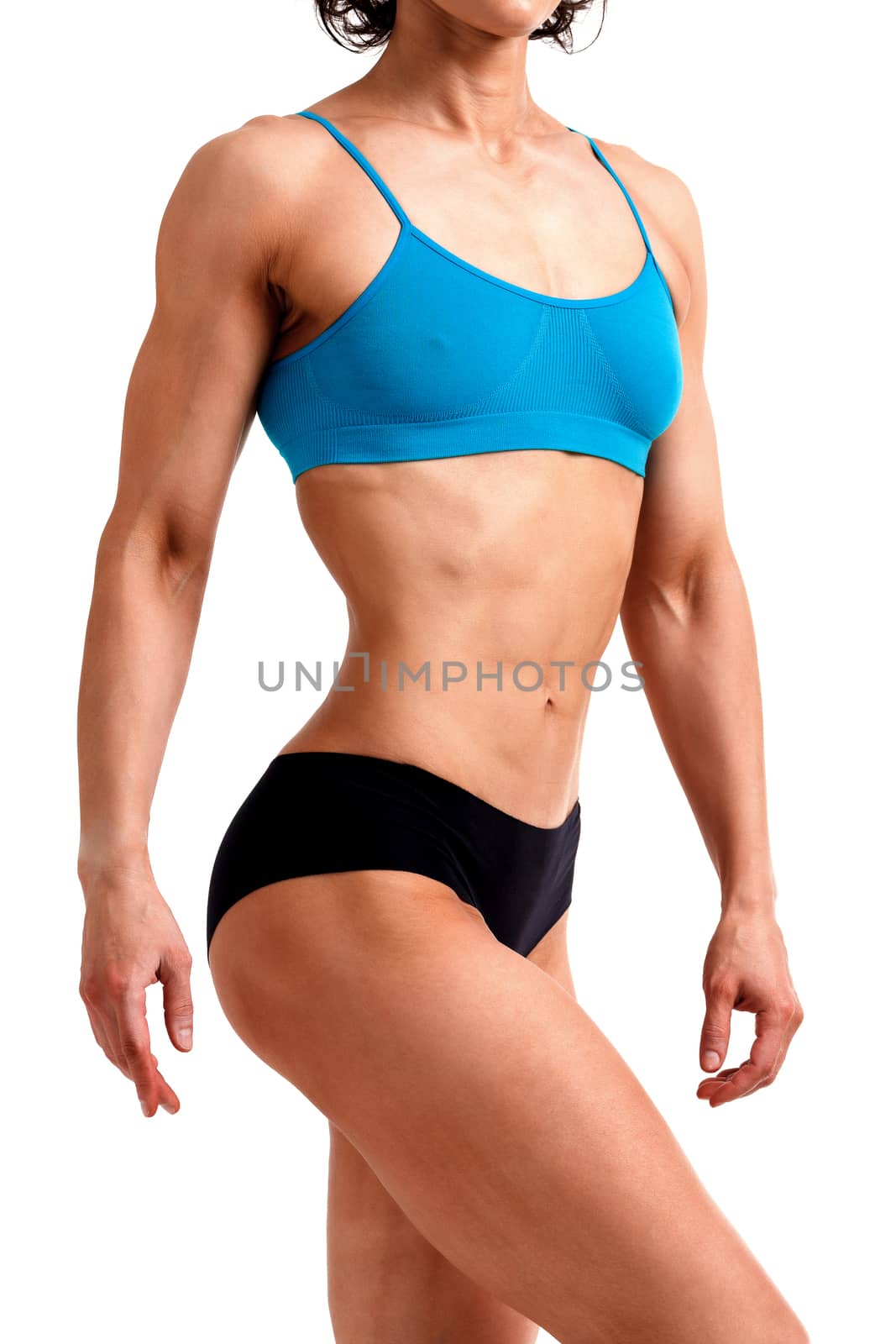 Fitness woman posing against a white background, isolated